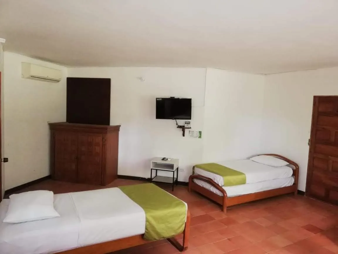 Communal lounge/ TV room, Bed in Finca Hotel La Estancia