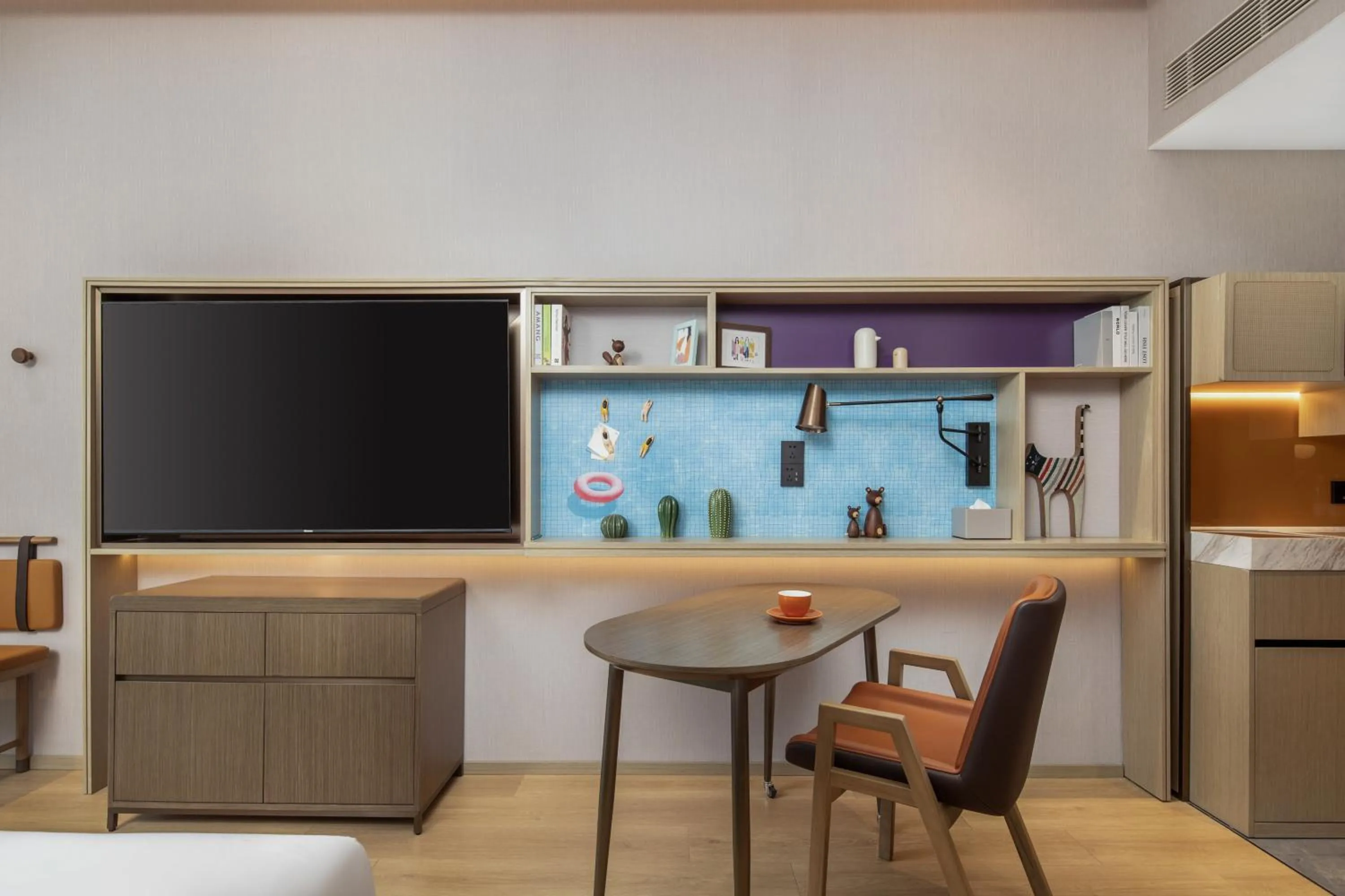 TV and multimedia in Home2 by Hilton Xinjiang Kuche