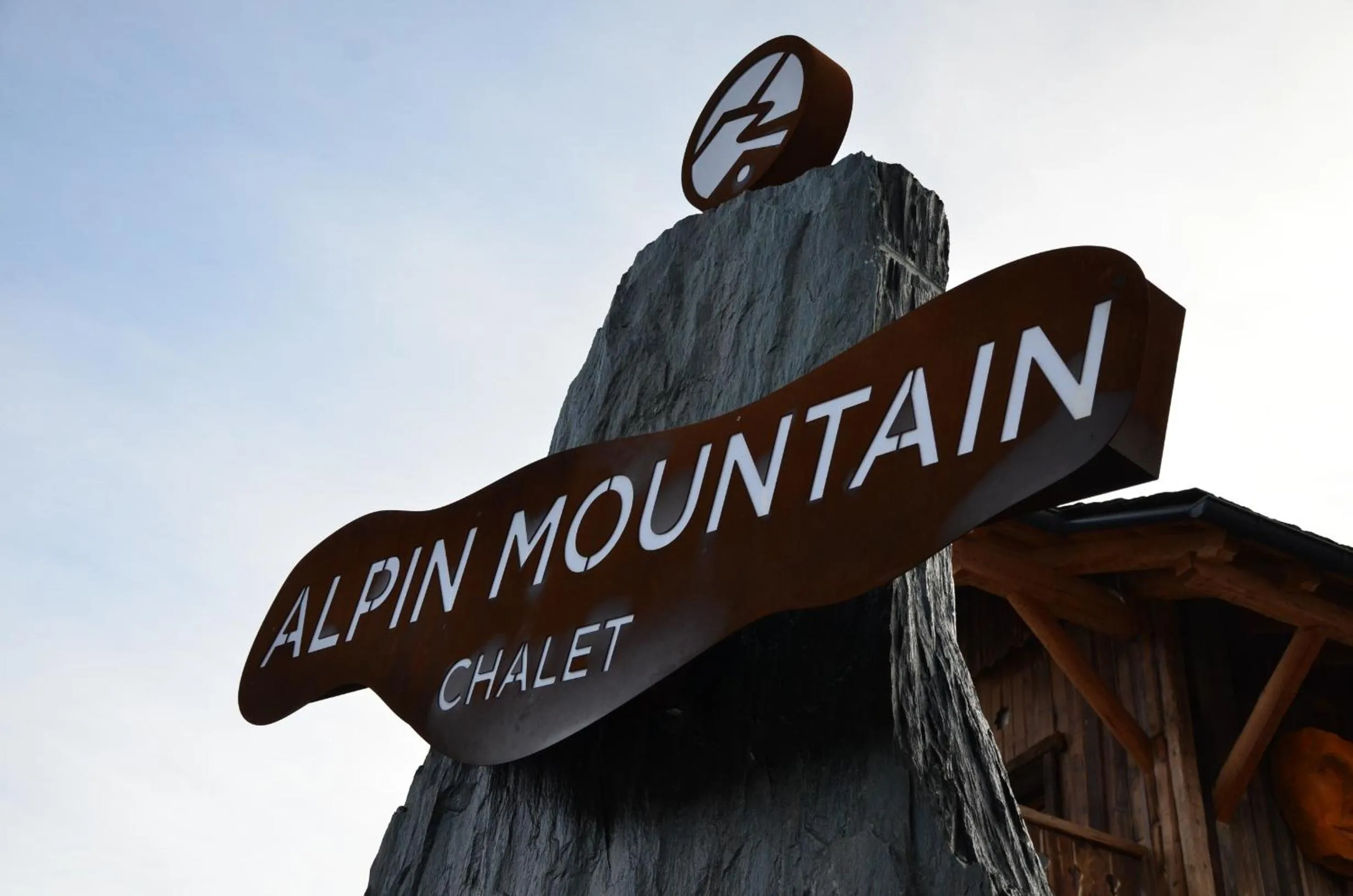 Property logo or sign in Alpine Mountain Chalet