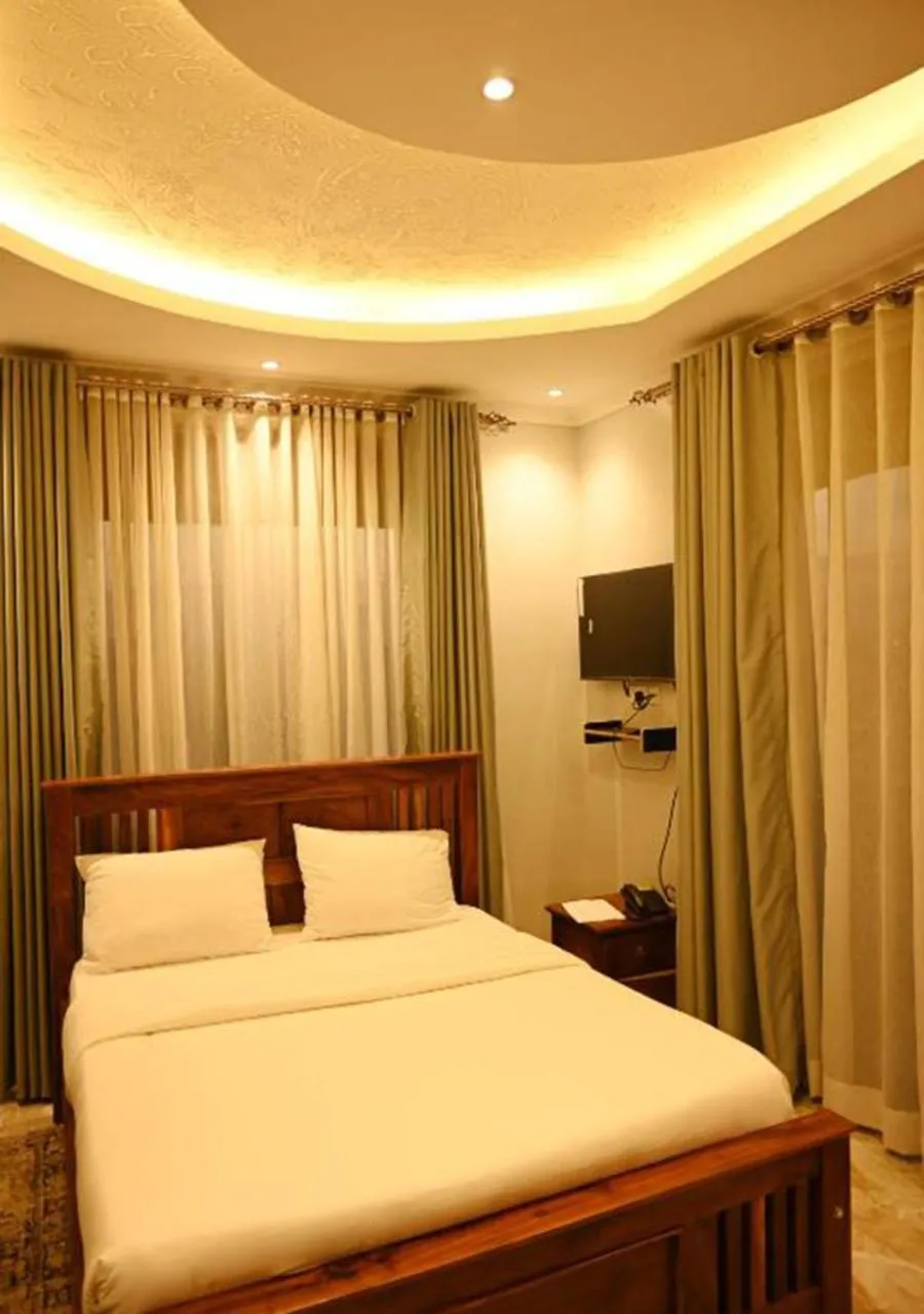 Bed in Neon Hotel Ntinda