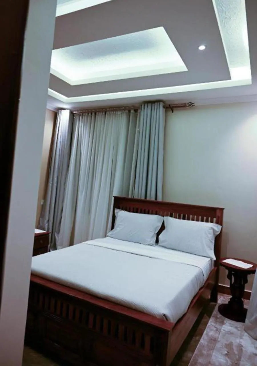 Bed in Neon Hotel Ntinda