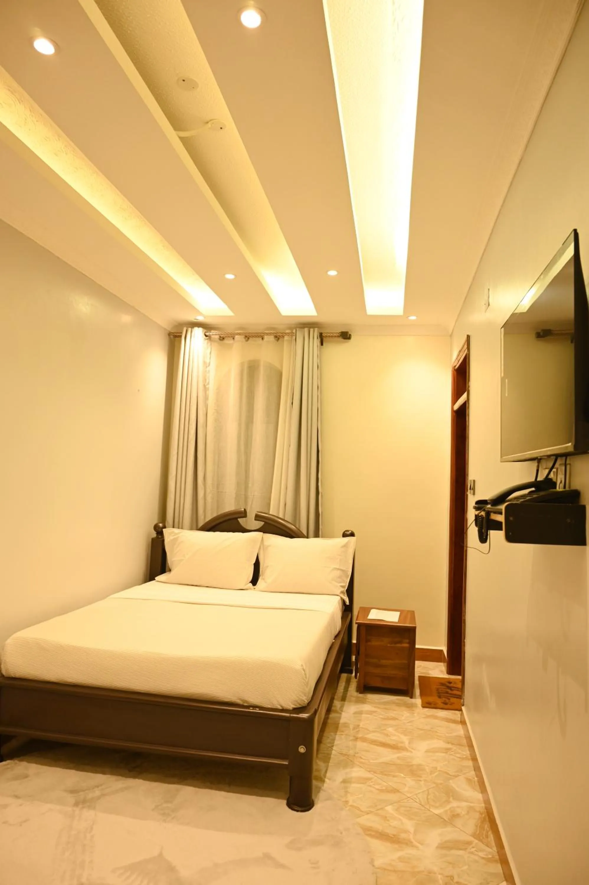 Bed in Neon Hotel Ntinda