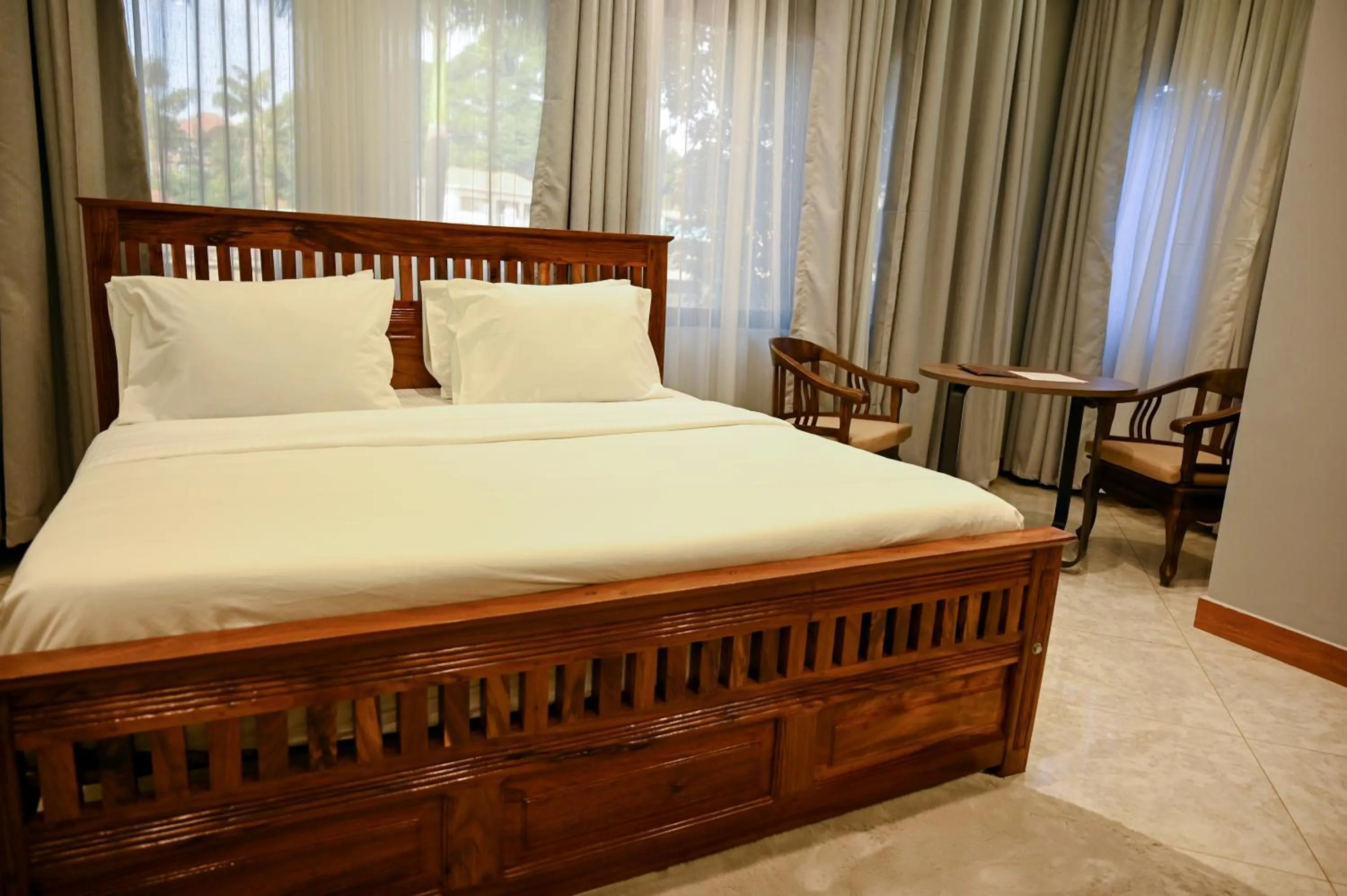 Bed in Neon Hotel Ntinda