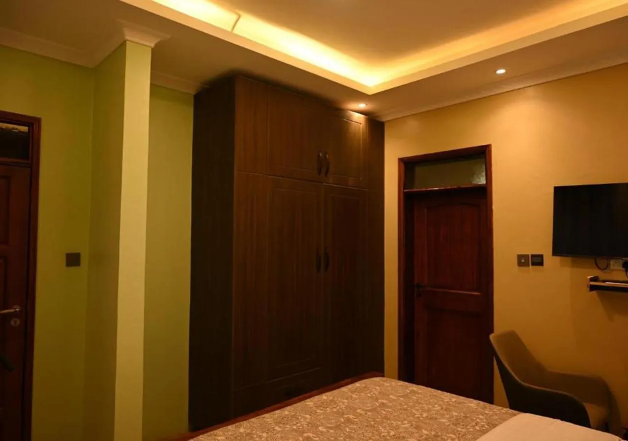 Bed in Neon Hotel Ntinda