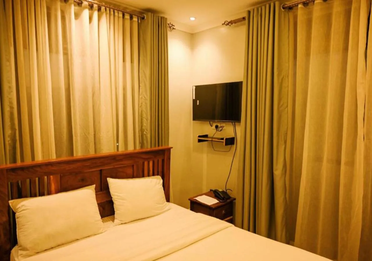 Bed in Neon Hotel Ntinda