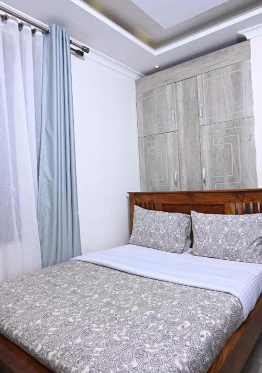 Bed in Neon Hotel Ntinda