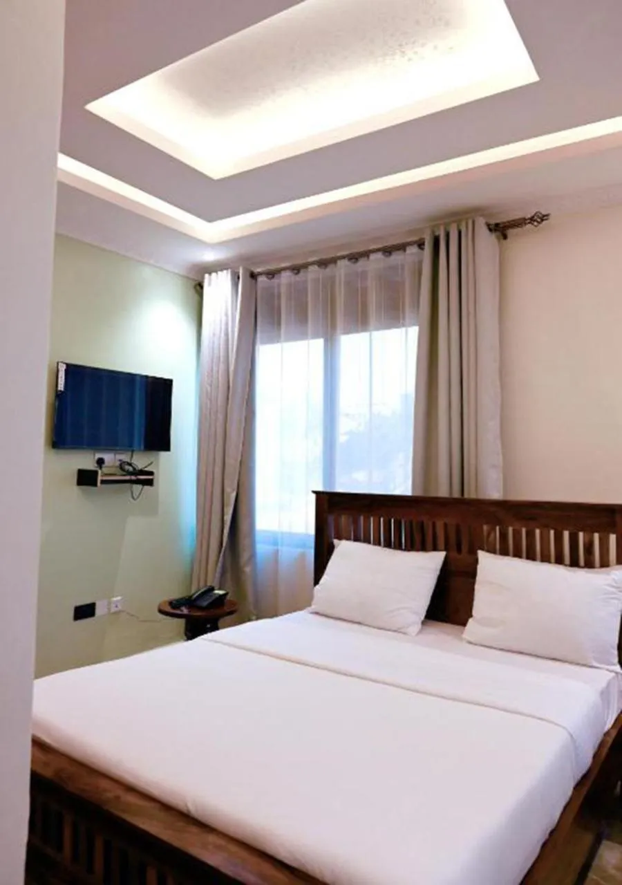 Bed in Neon Hotel Ntinda