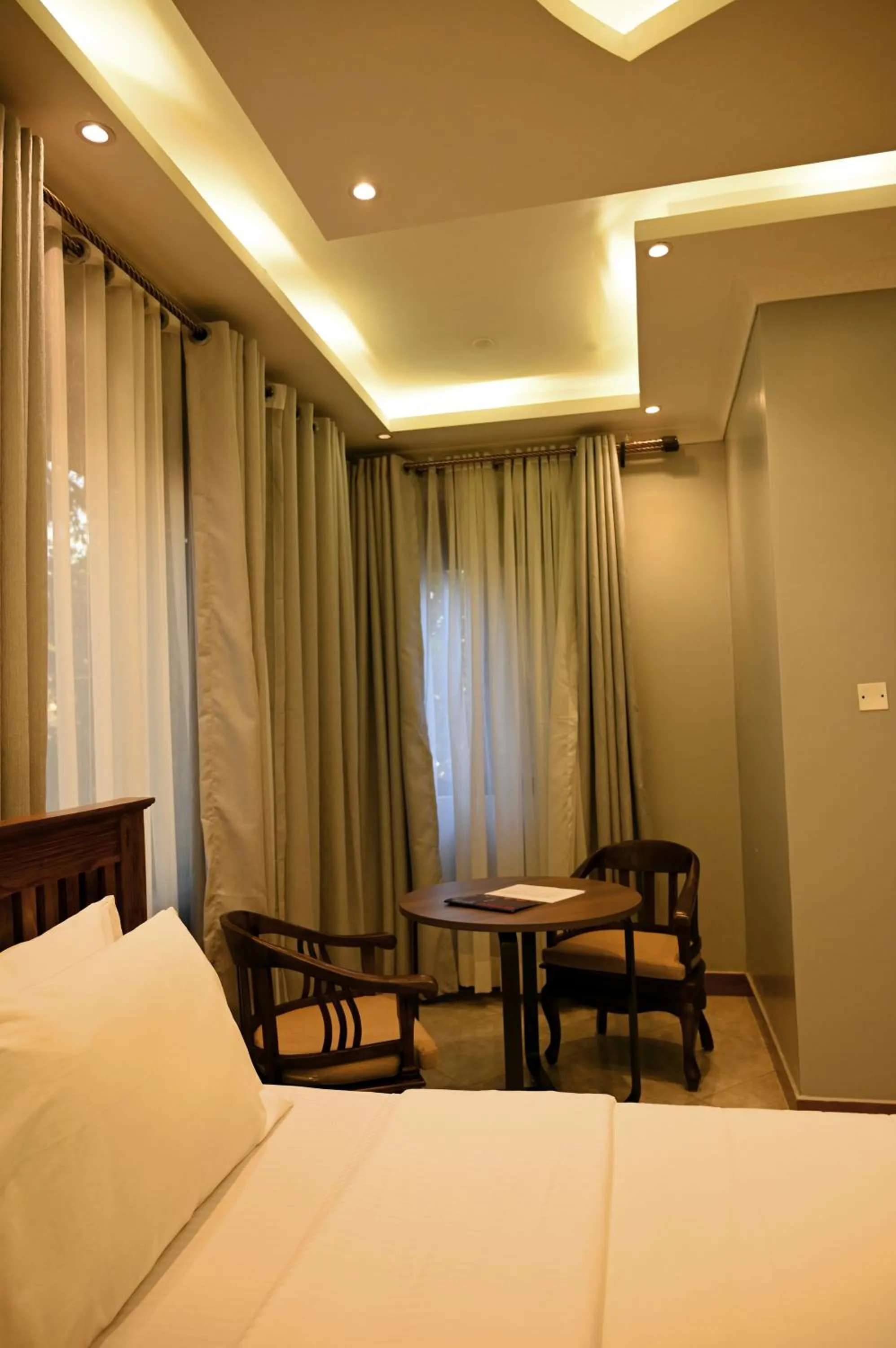 Bed in Neon Hotel Ntinda