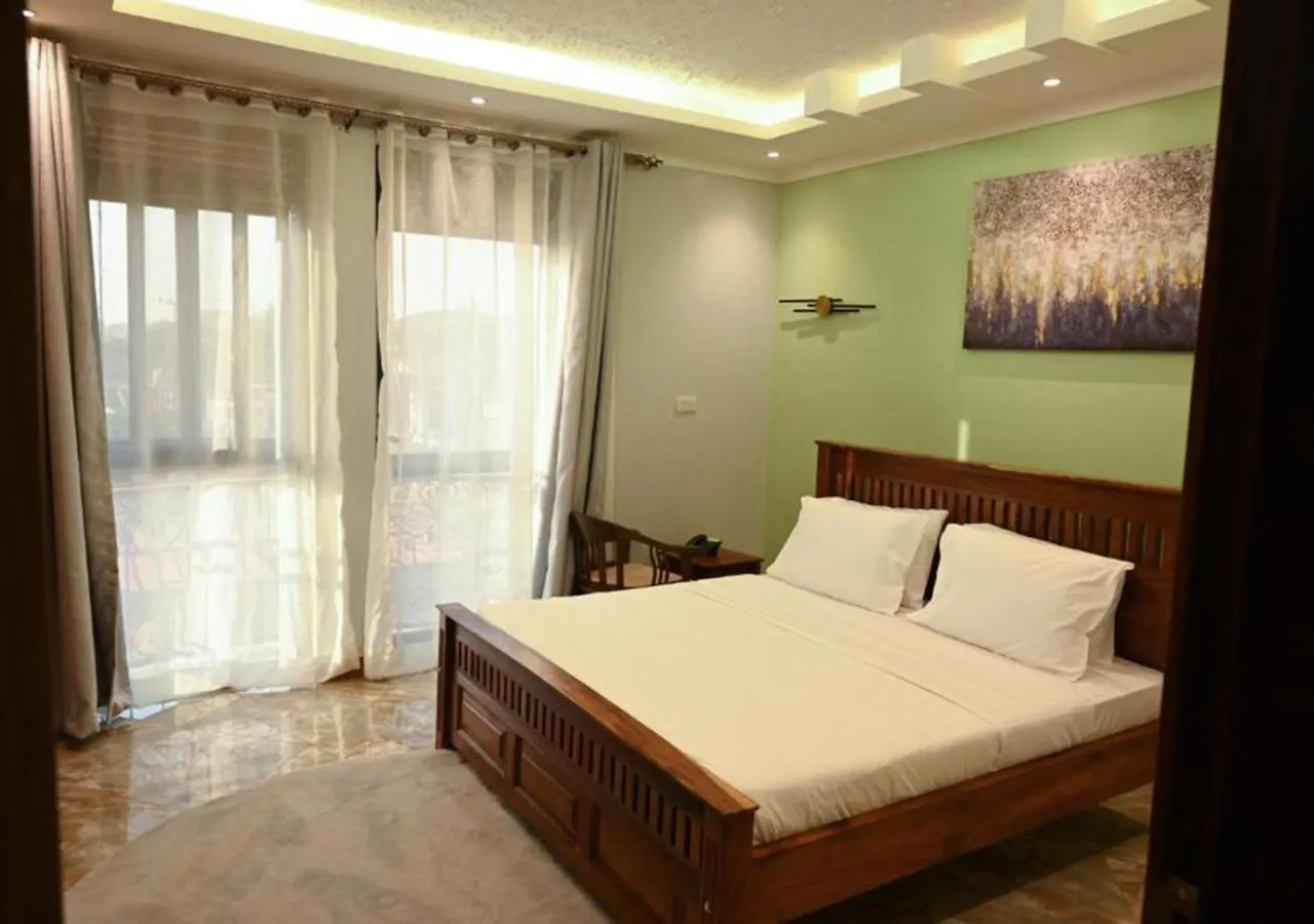 Bed in Neon Hotel Ntinda