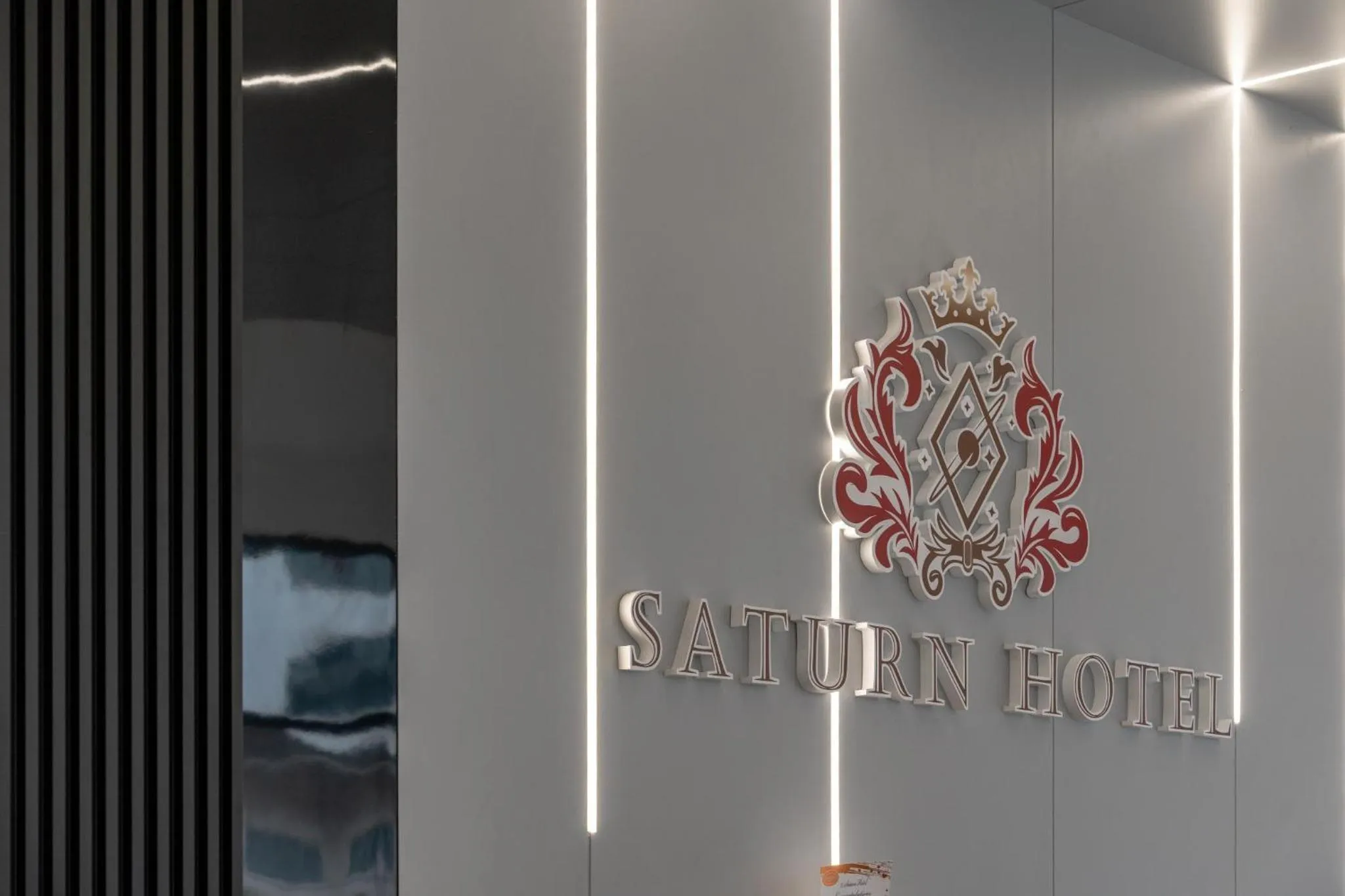 Property logo or sign in Saturn Hotel