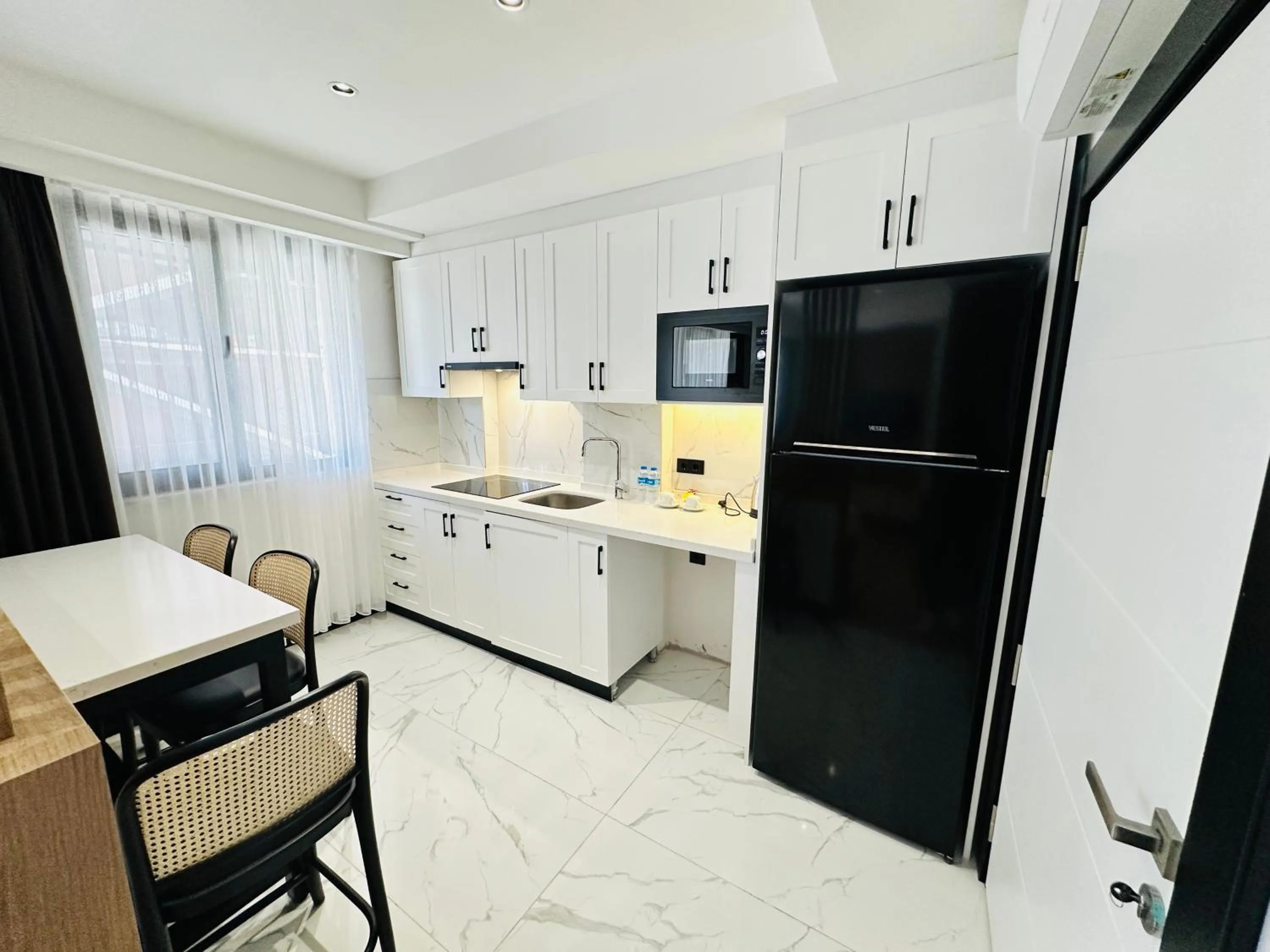 Kitchen or kitchenette in Rose Point Residence