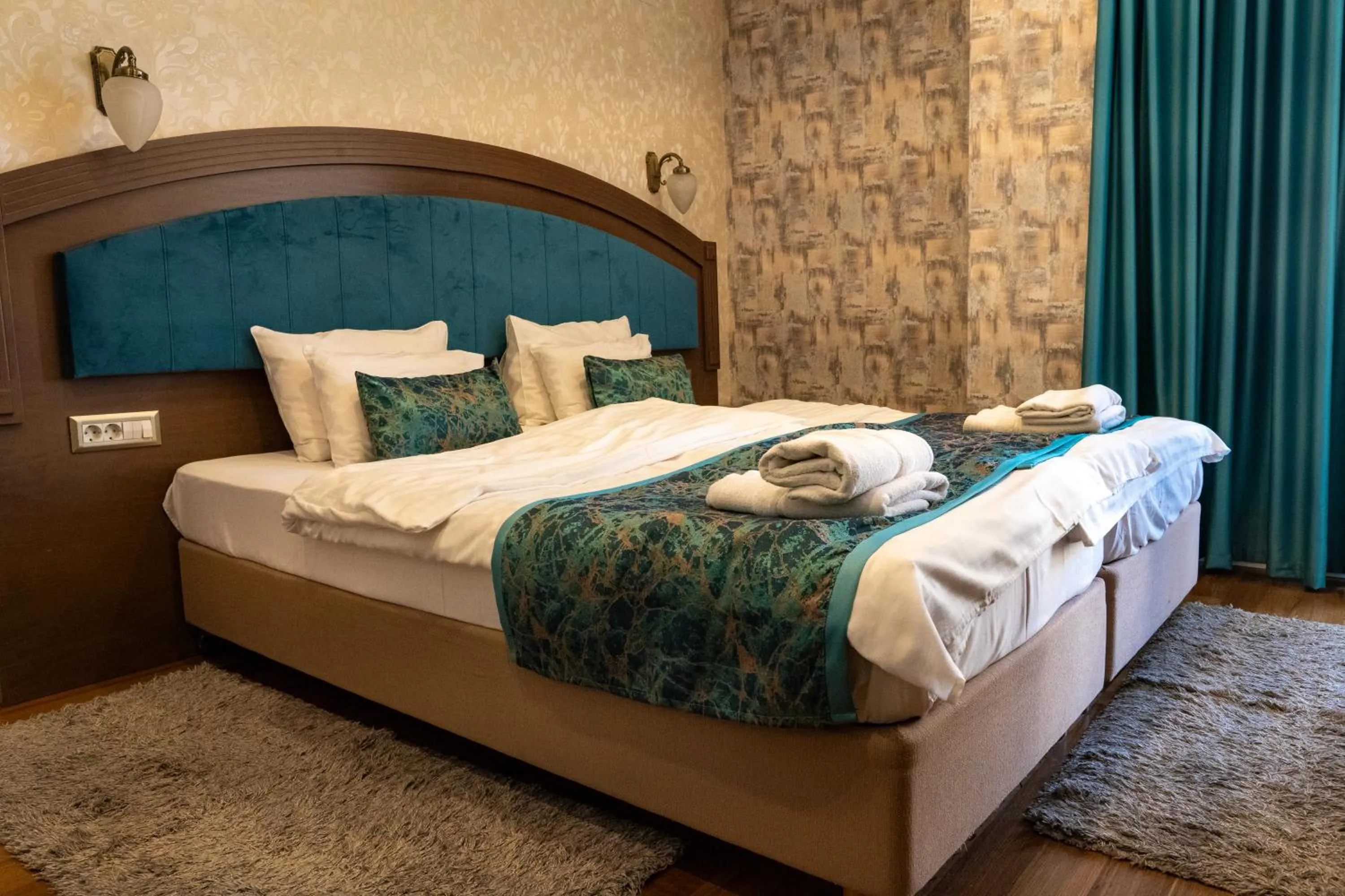 Bed in City Palace Hotel