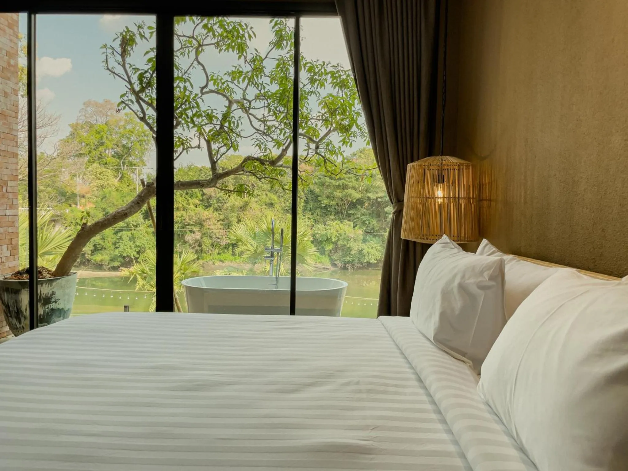 Bed in Historykan Kanchanaburi Hotel