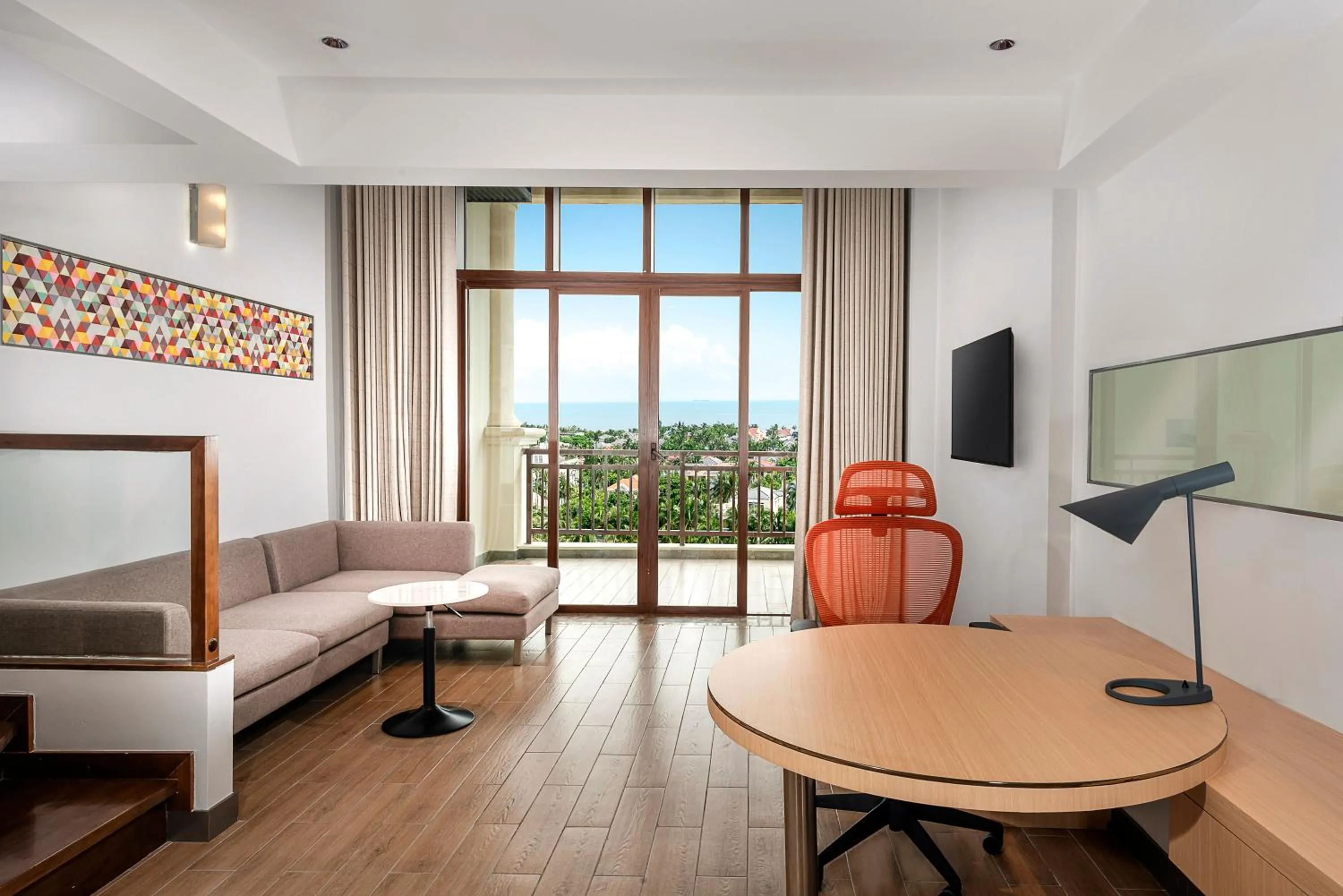 Communal lounge/ TV room in Holiday Inn Express Haikou West Coast by IHG