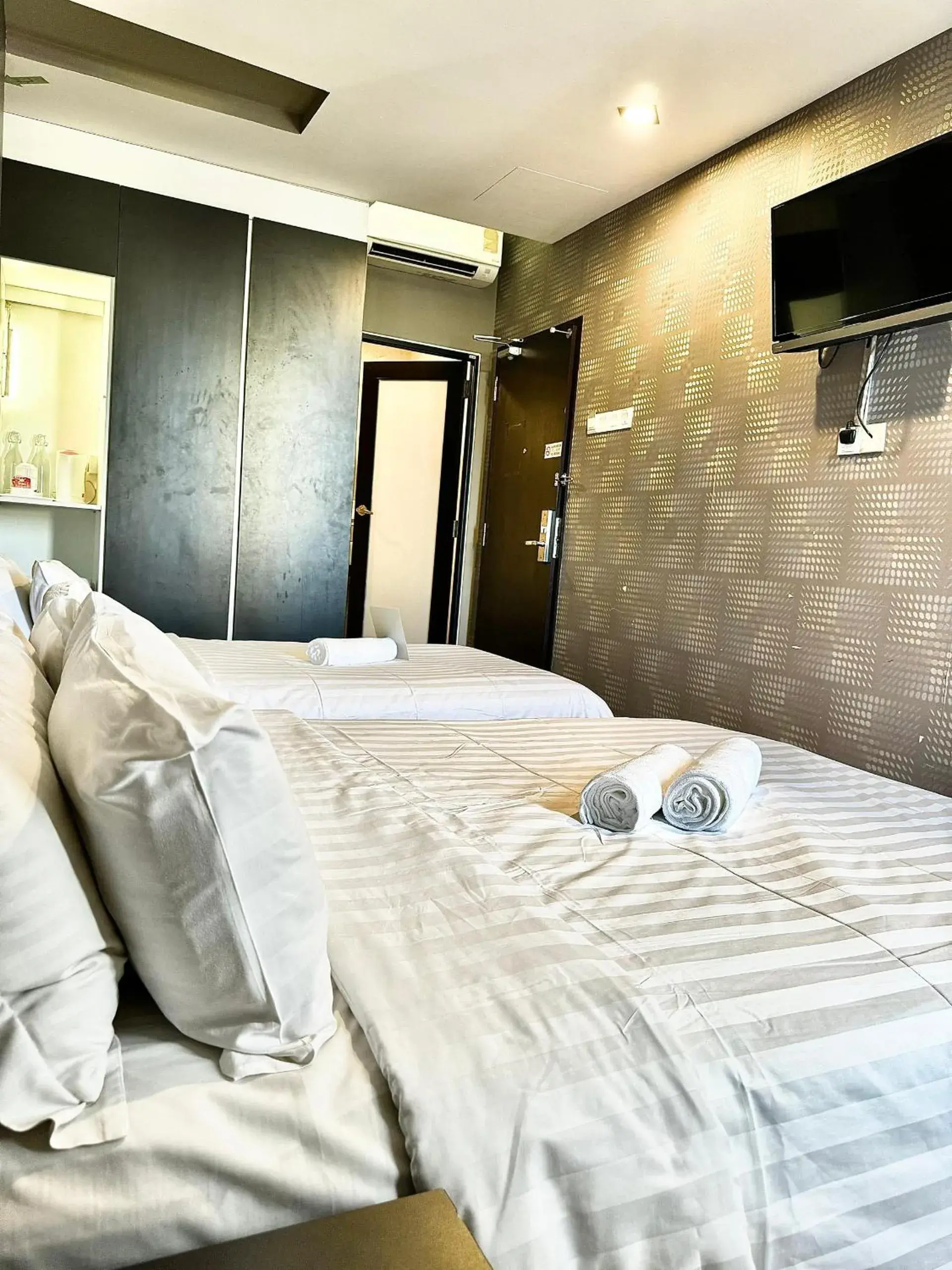 Bed in Chariton Hotel Nusa Bestari Bed in Chariton Hotel Nusa Bestari