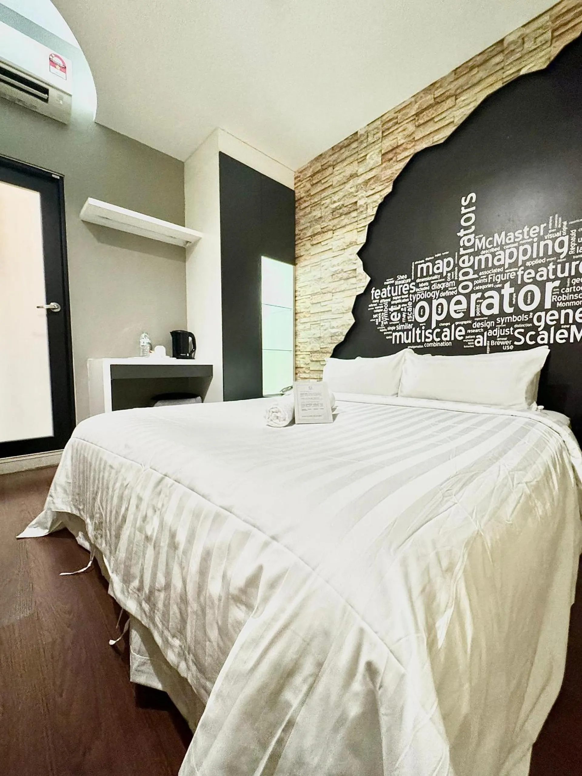 Bed in Chariton Hotel Nusa Bestari