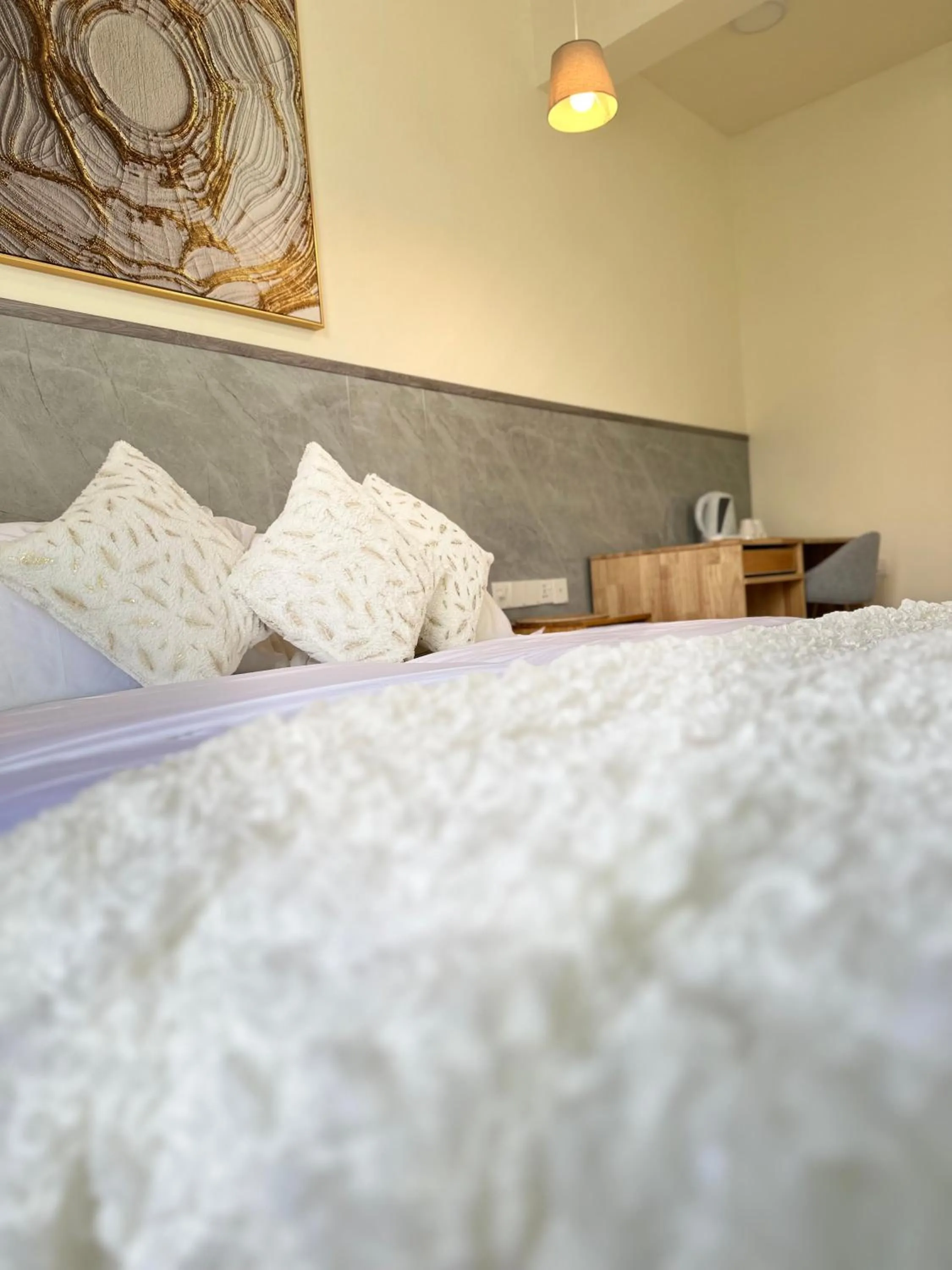 Bed in YUVi Blue Maldives & spa