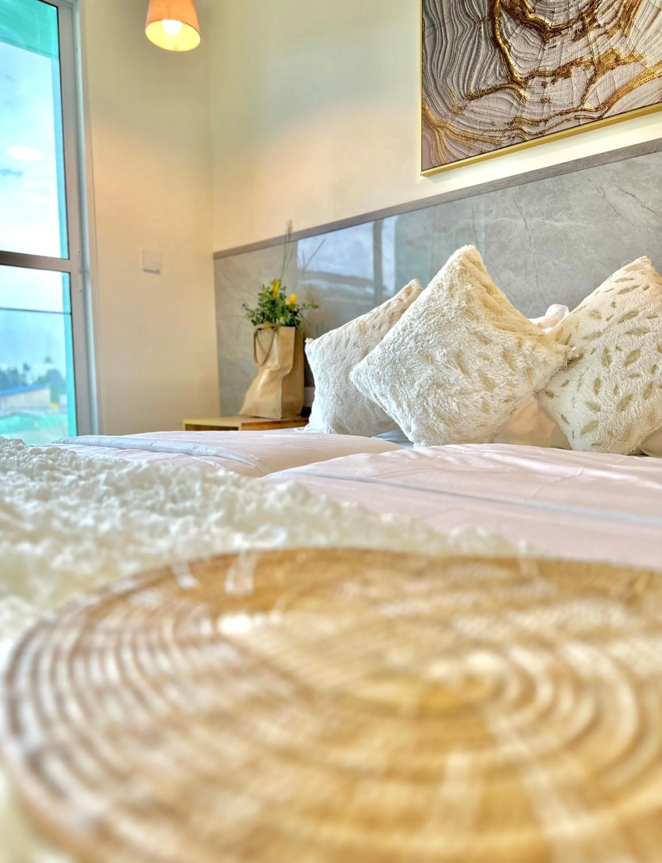 Bed in YUVi Blue Maldives & spa