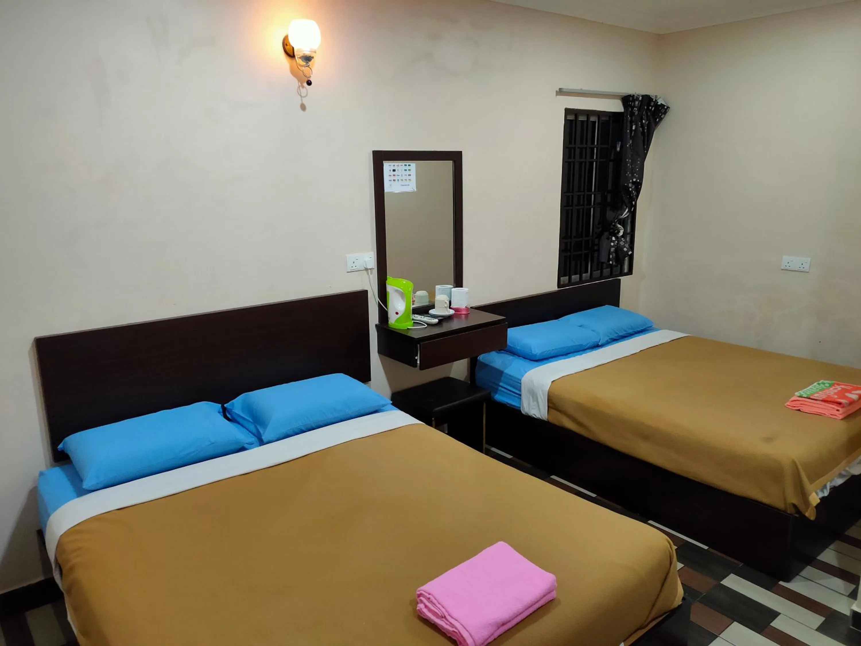 Bed in Ria Cameron Hotel