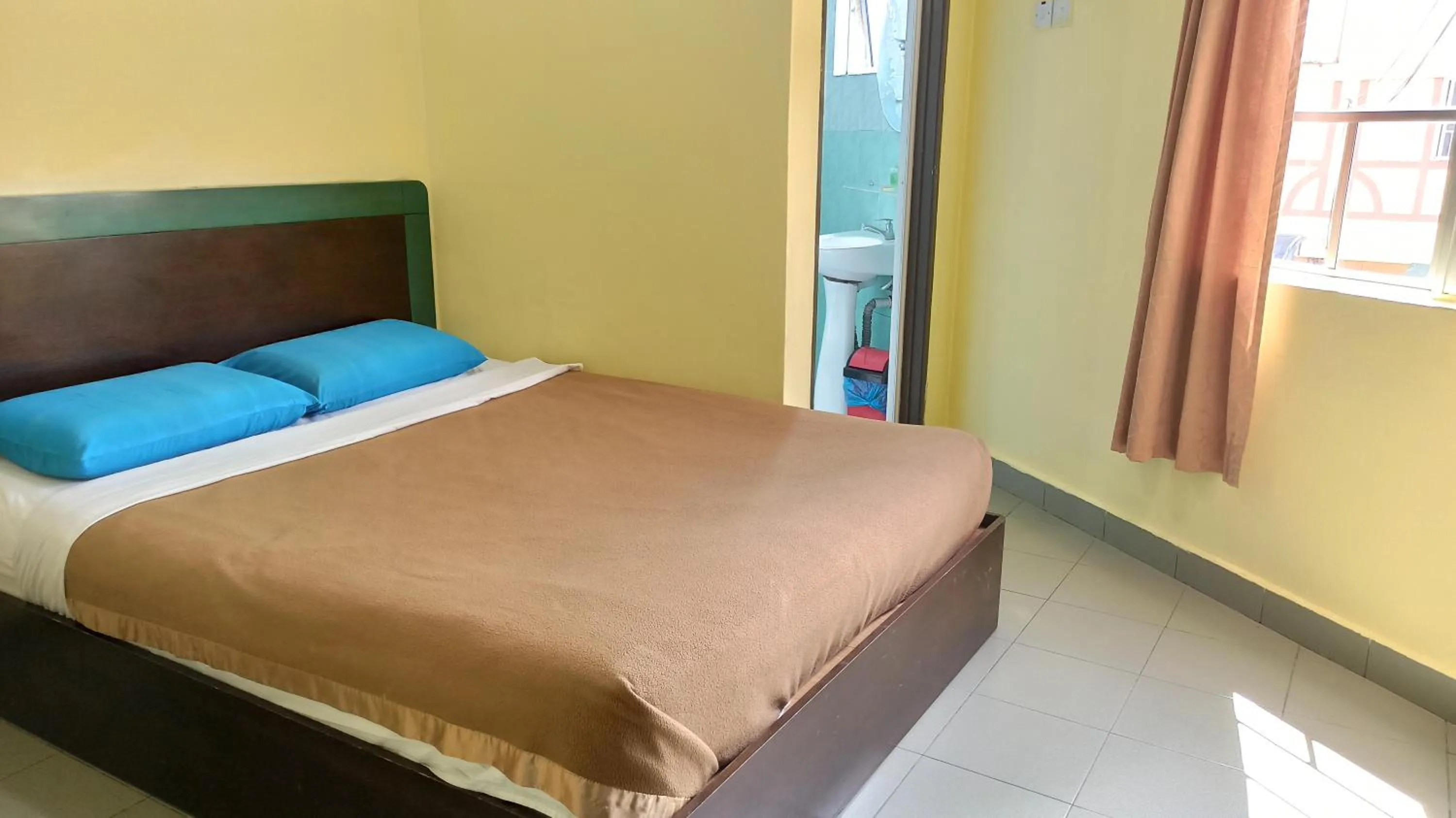 Bed in Ria Cameron Hotel