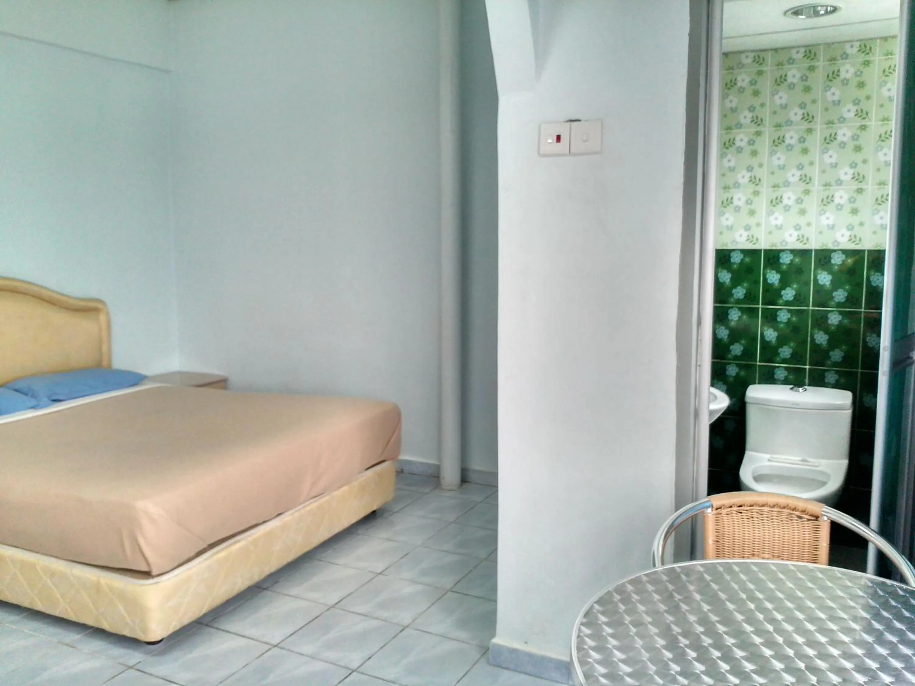 Bed in Ria Cameron Hotel