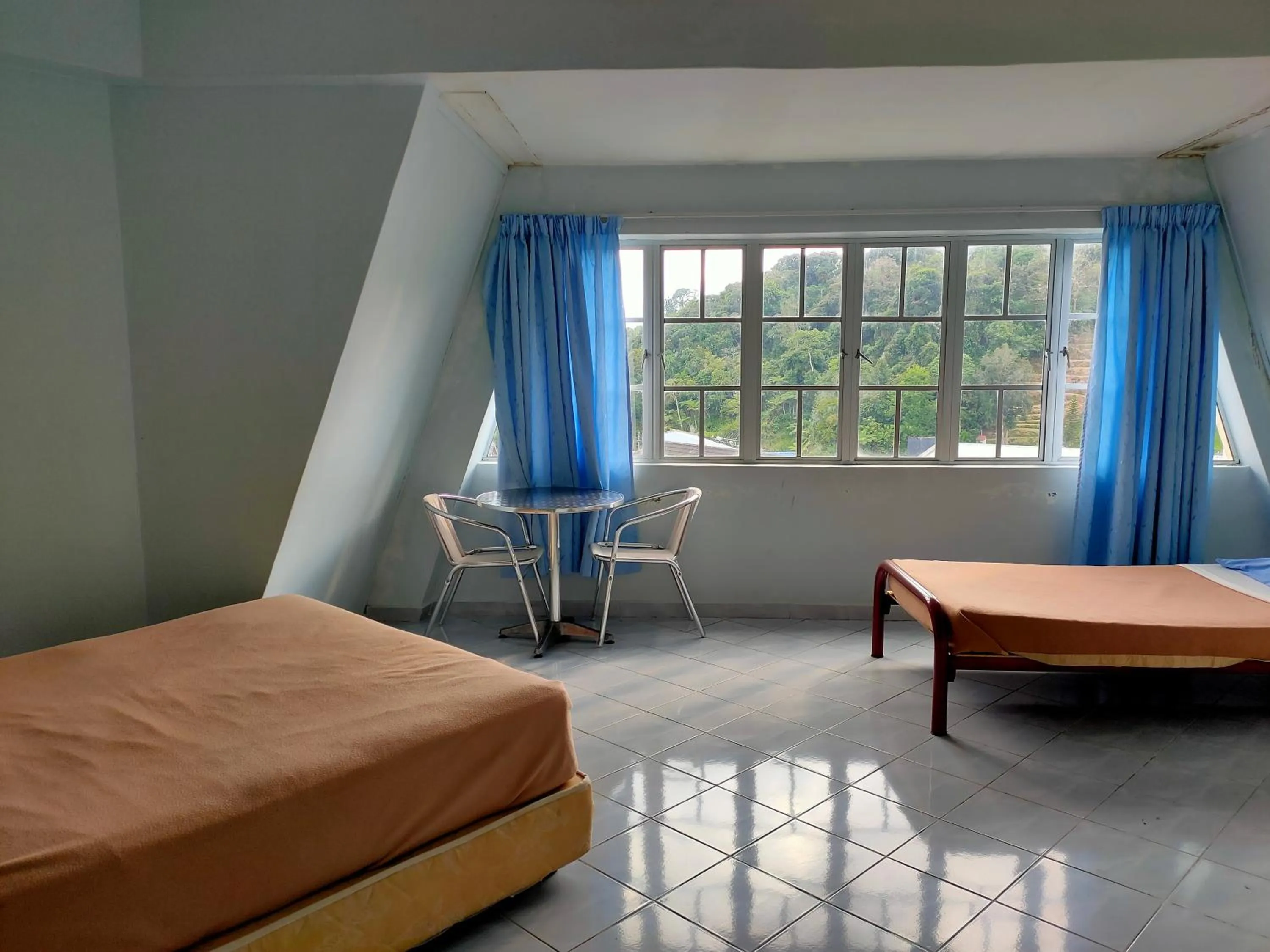 Bed in Ria Cameron Hotel