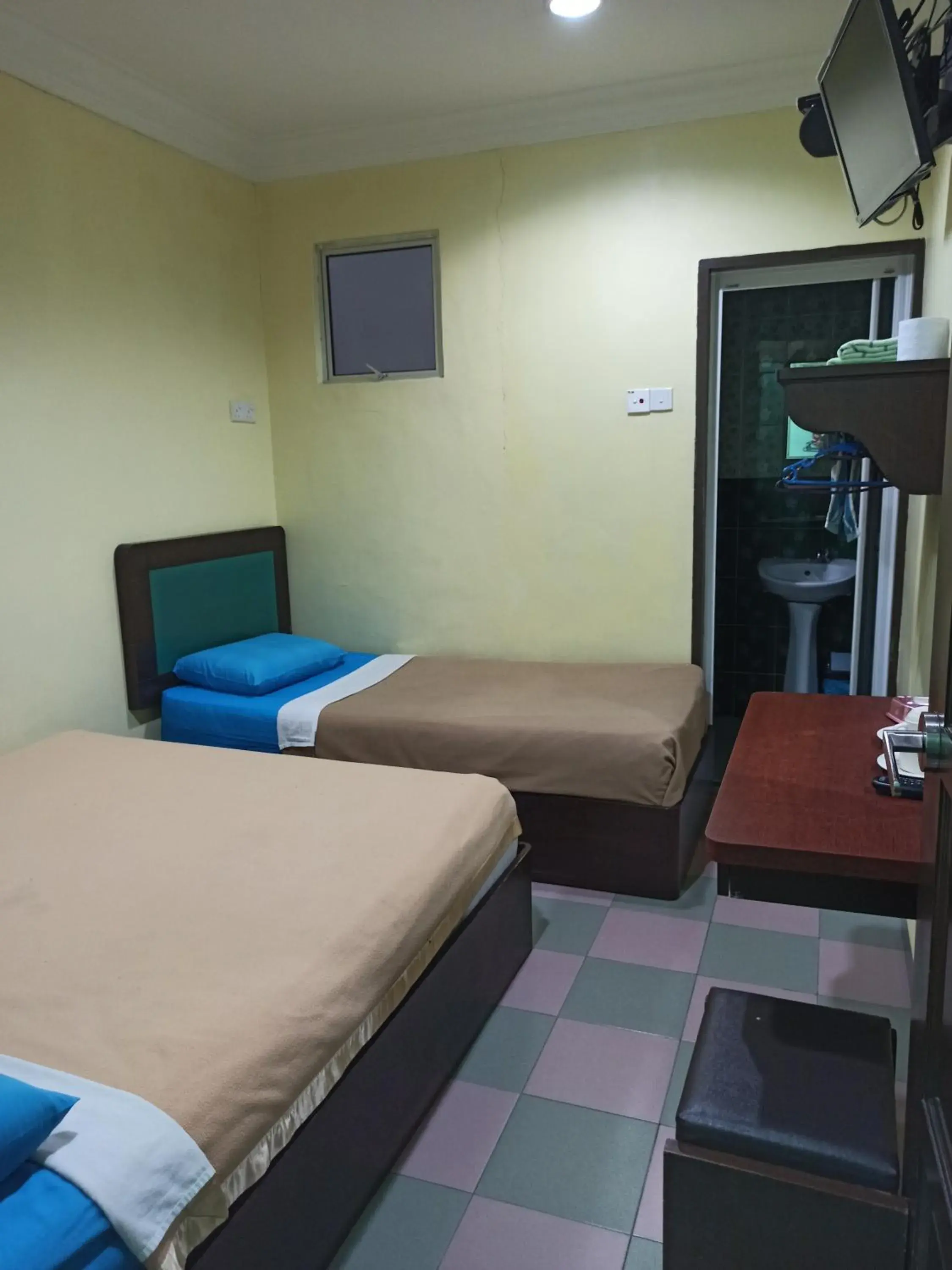 Bed in Ria Cameron Hotel Bed in Ria Cameron Hotel