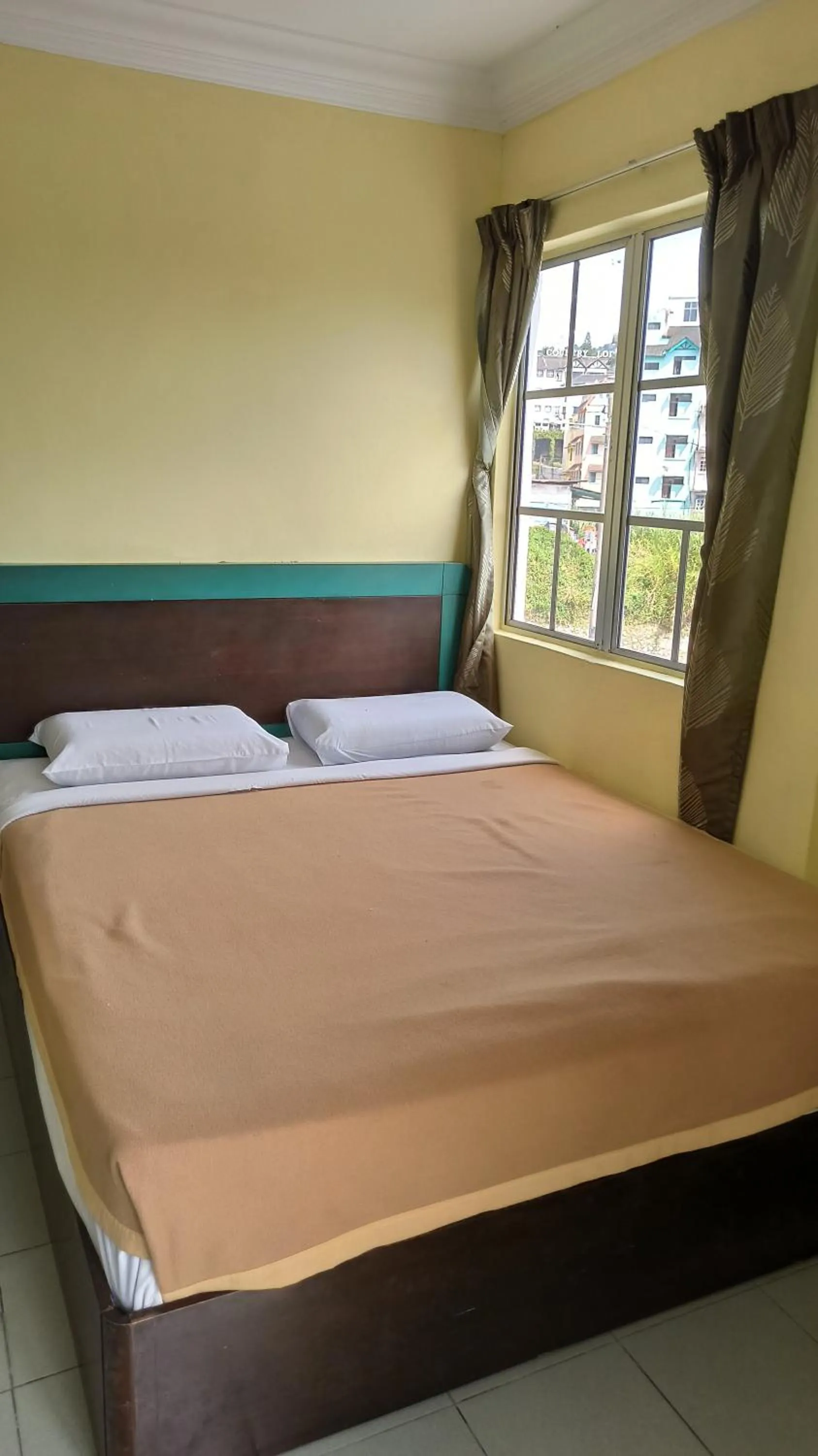 Bed in Ria Cameron Hotel