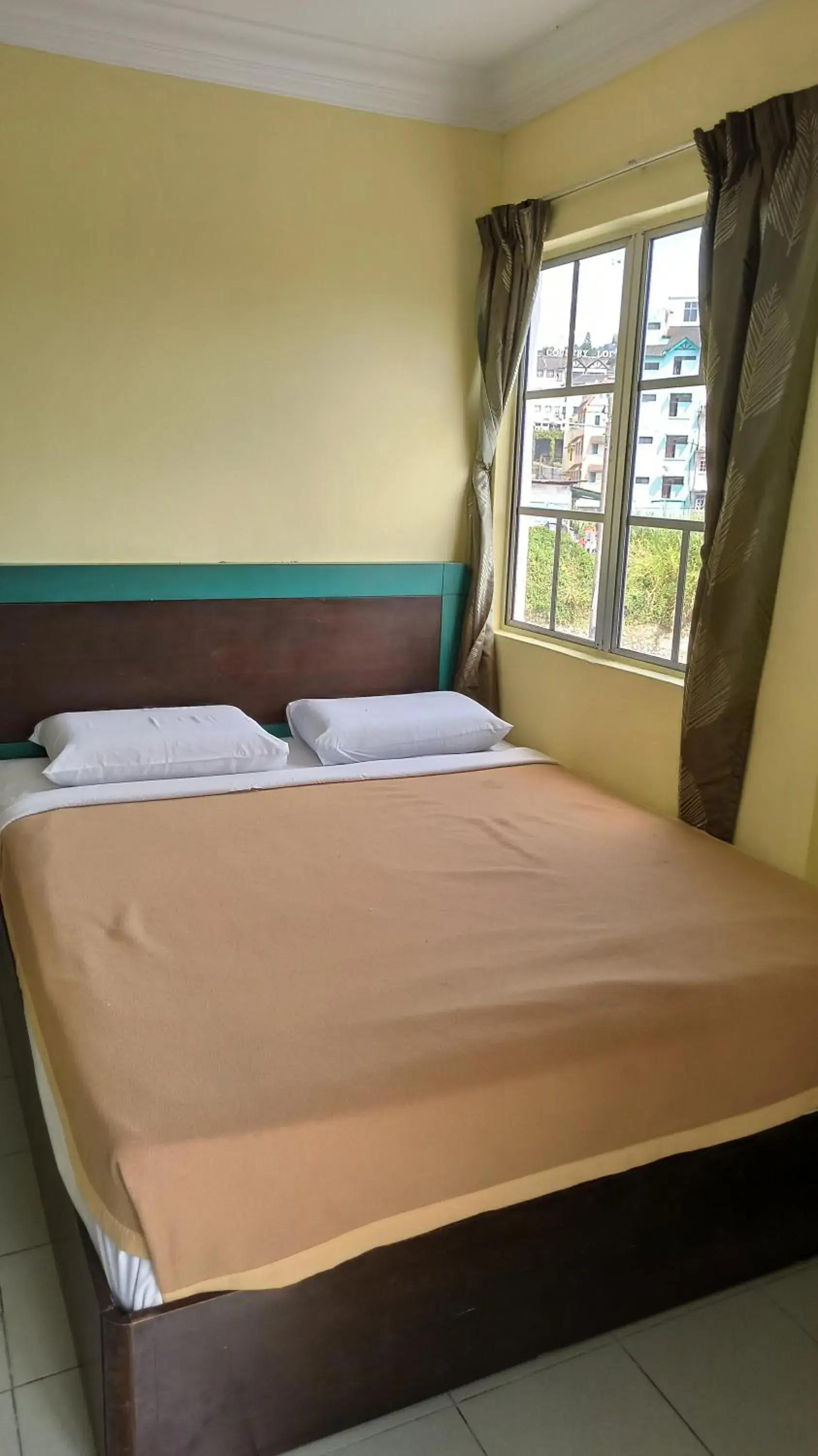 Bed in Ria Cameron Hotel Bed in Ria Cameron Hotel