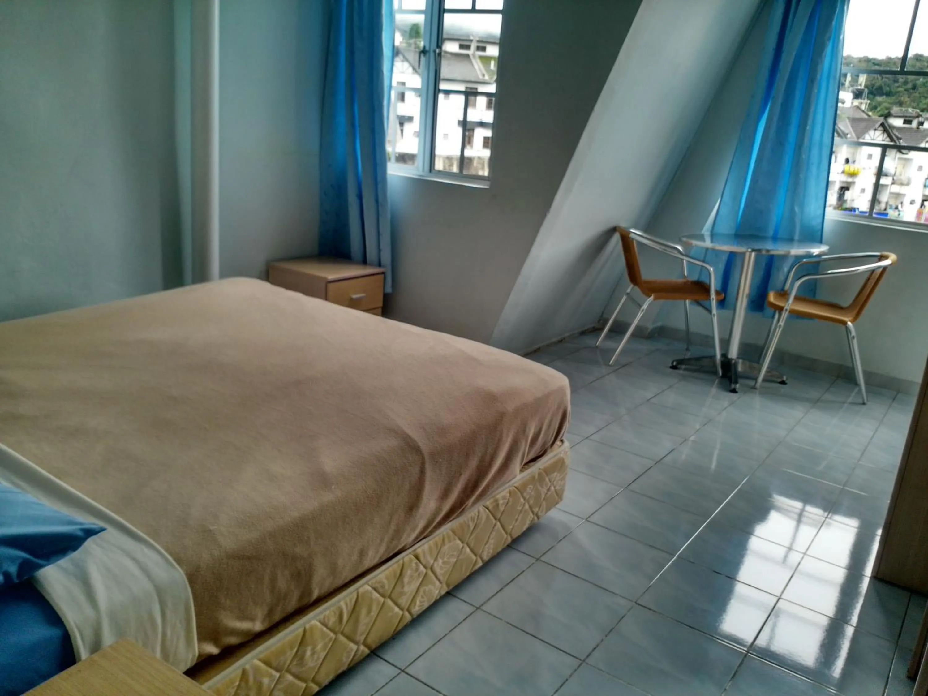 Bed in Ria Cameron Hotel