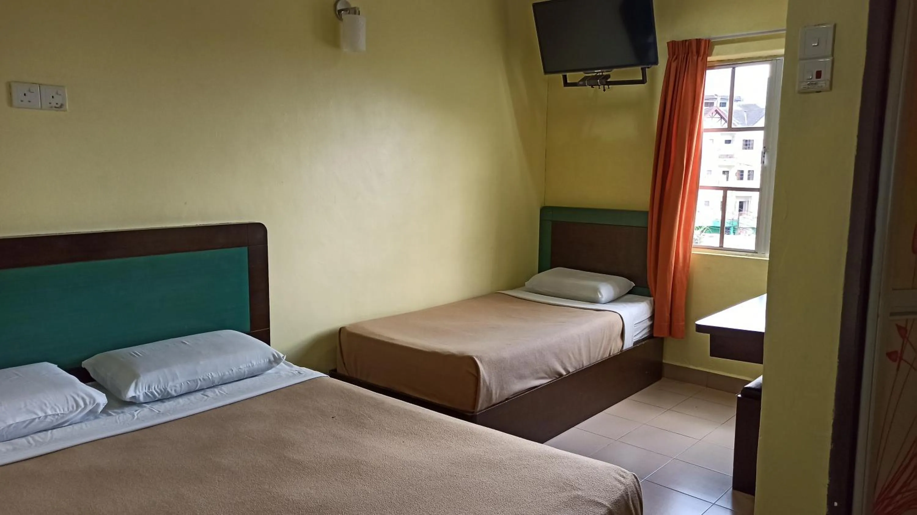 Bed in Ria Cameron Hotel