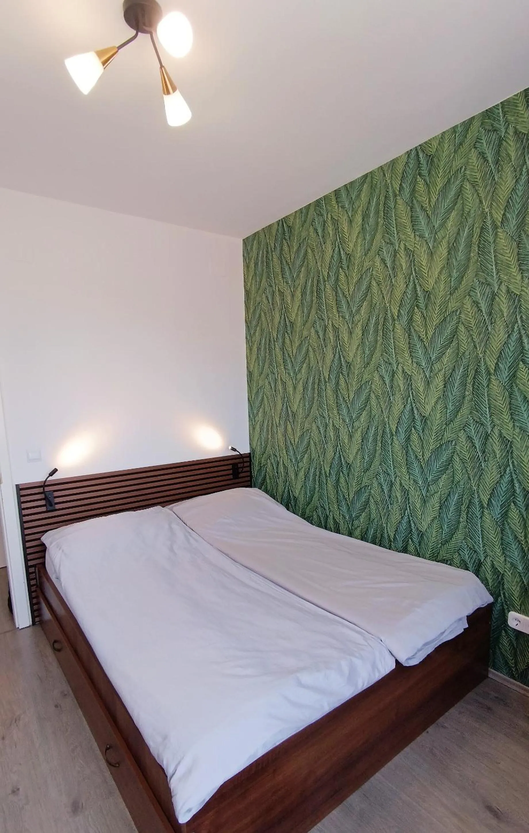 Bed in Nidius Apartment