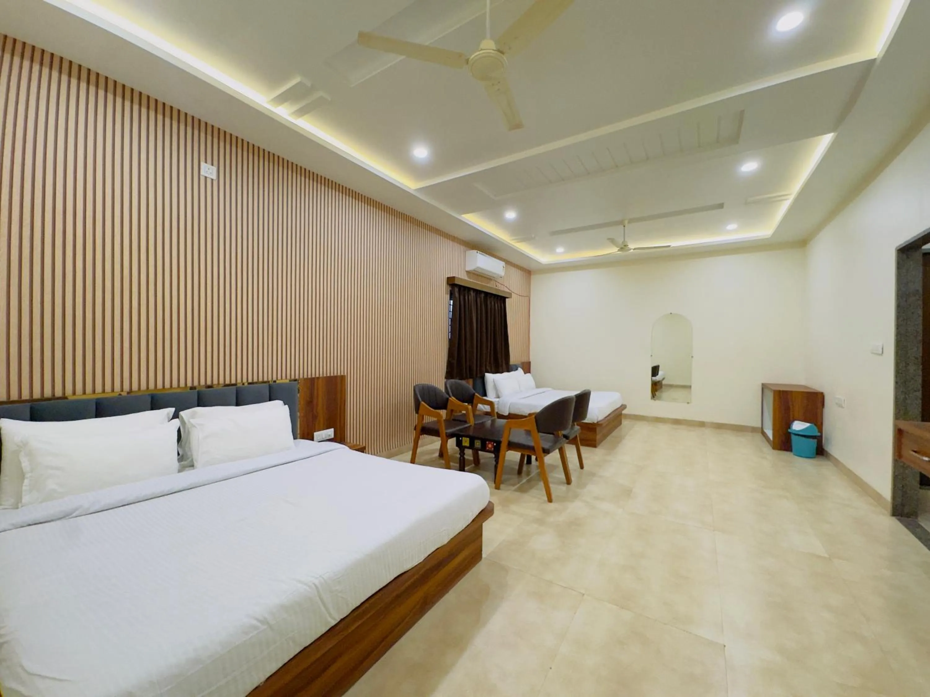 Photo of the whole room, Bed in Hotel Jyotirlinga- One Way Drop to Mahakal Temple