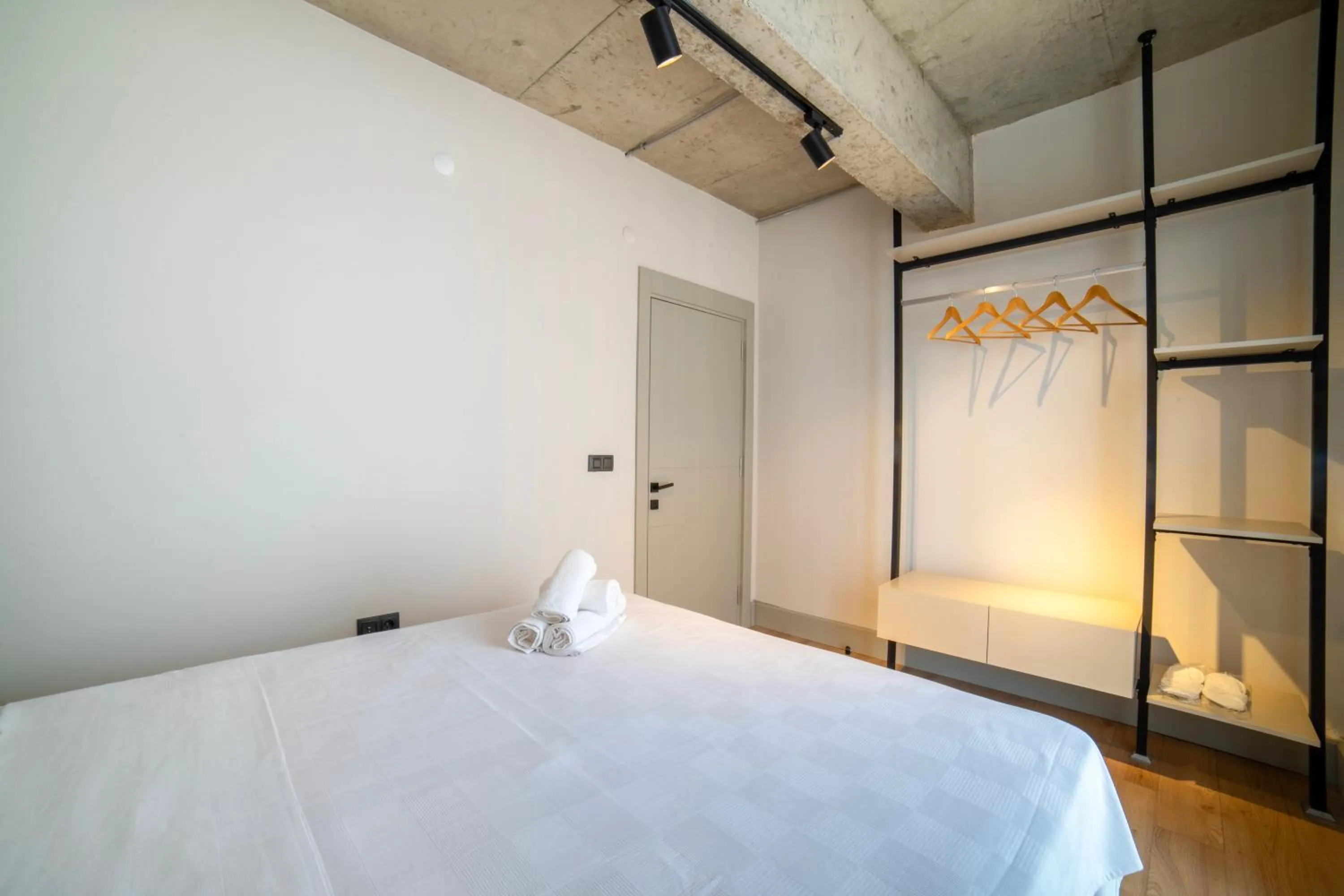 Bed in RudBlu Suites