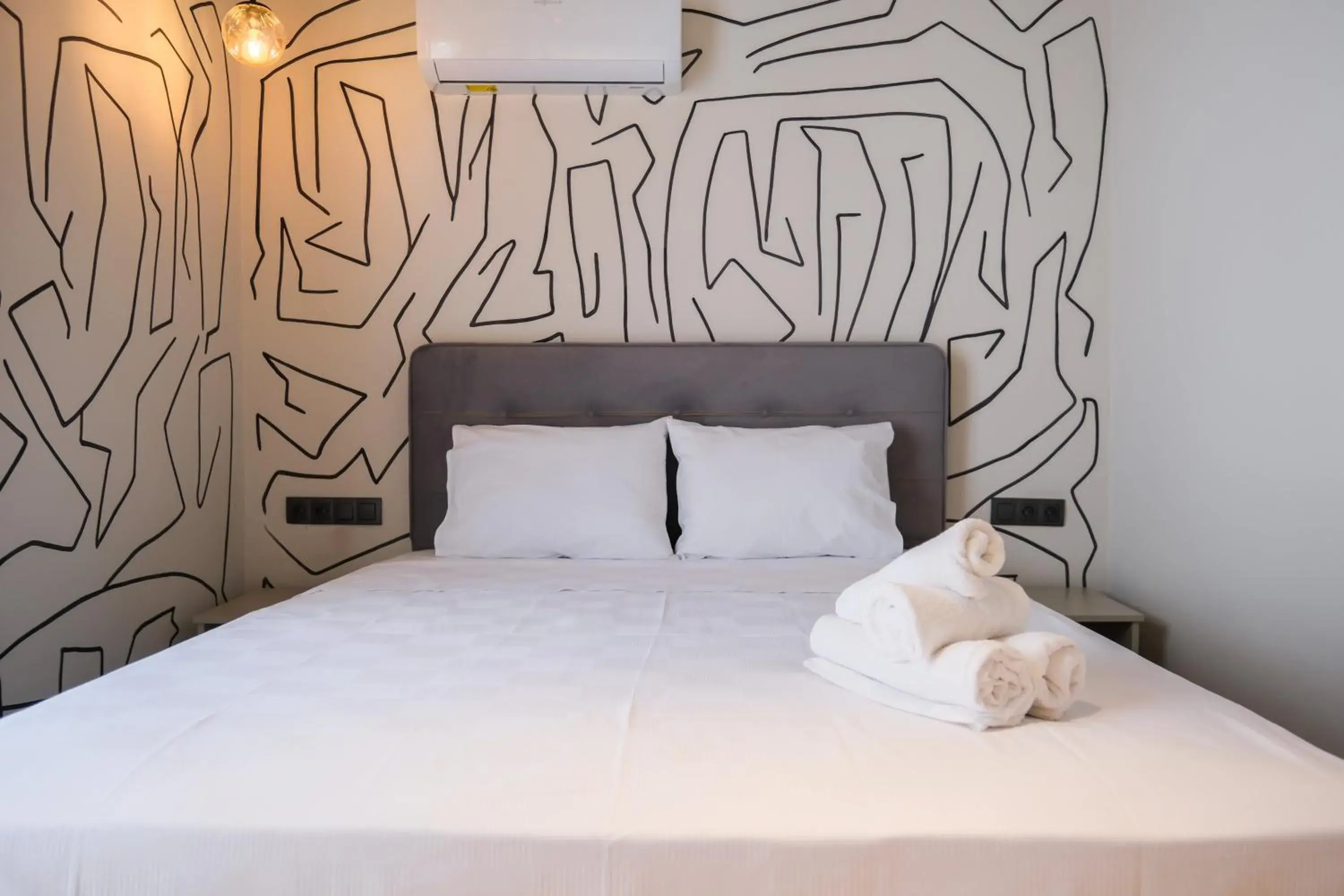 Bed in RudBlu Suites Bed in RudBlu Suites