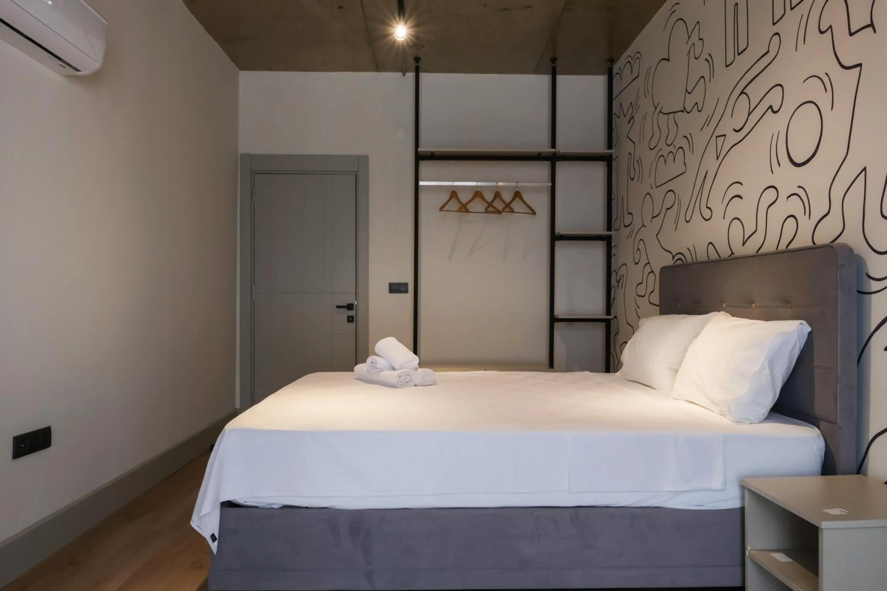 Bed in RudBlu Suites