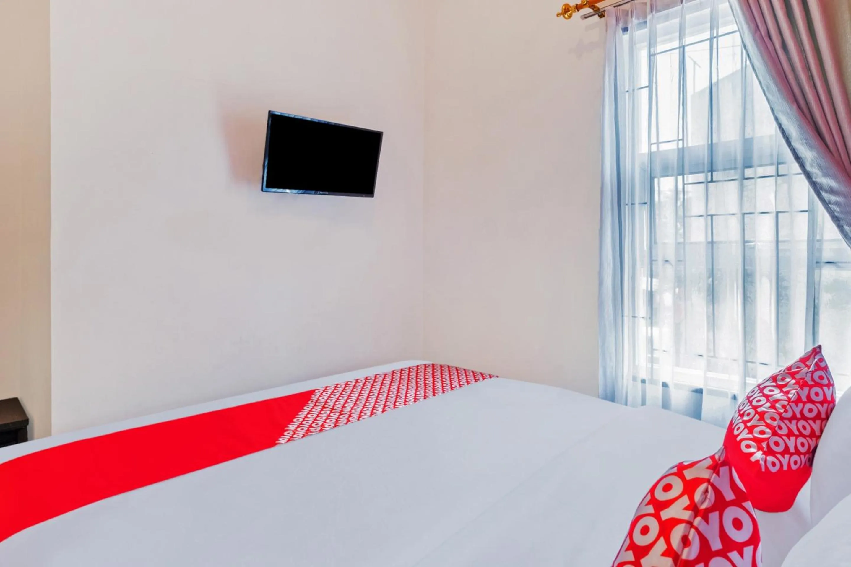 Bedroom in Hotel O Sudirman Guesthouse Syariah