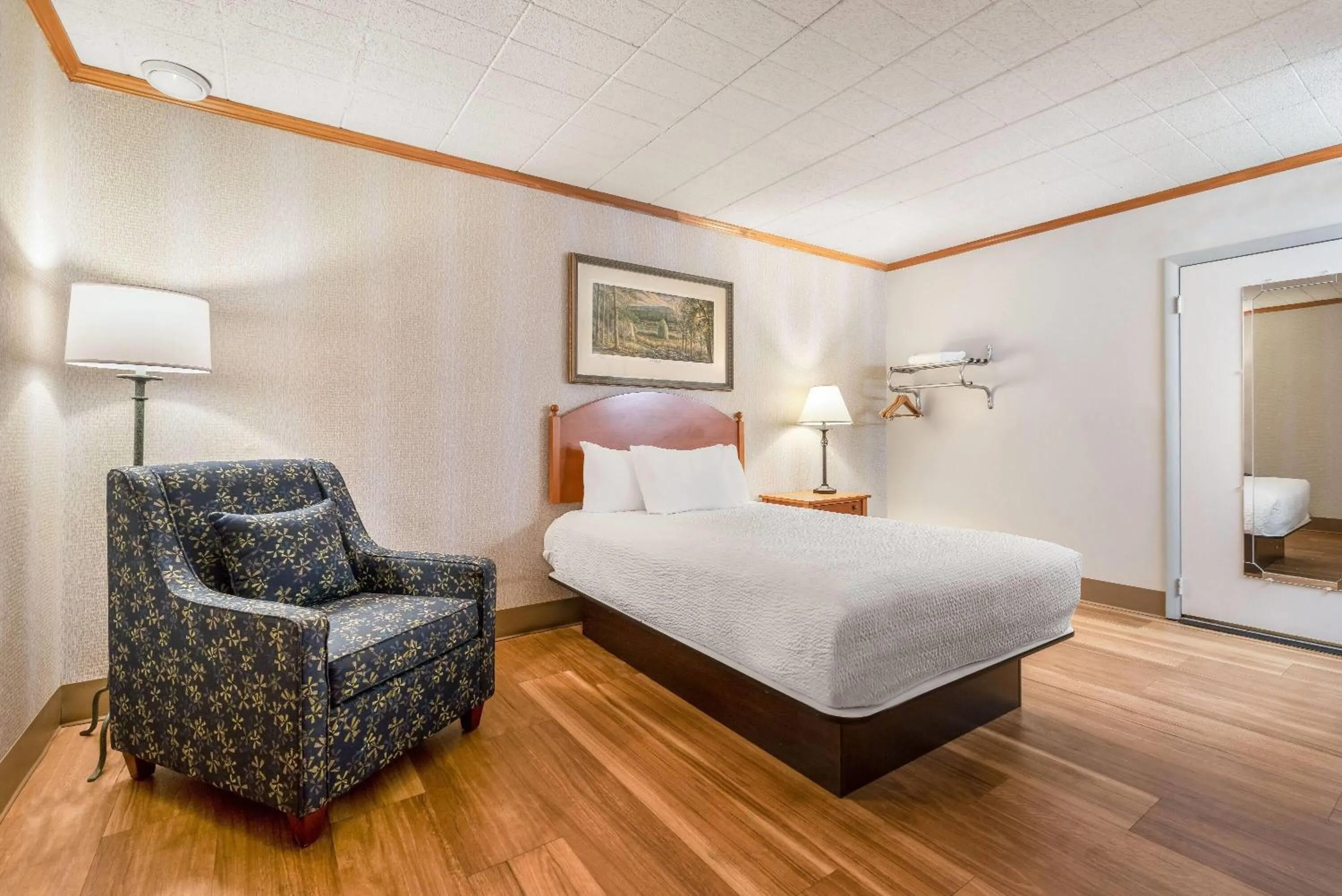 Bed in Ramada by Wyndham State College Hotel & Conference Center