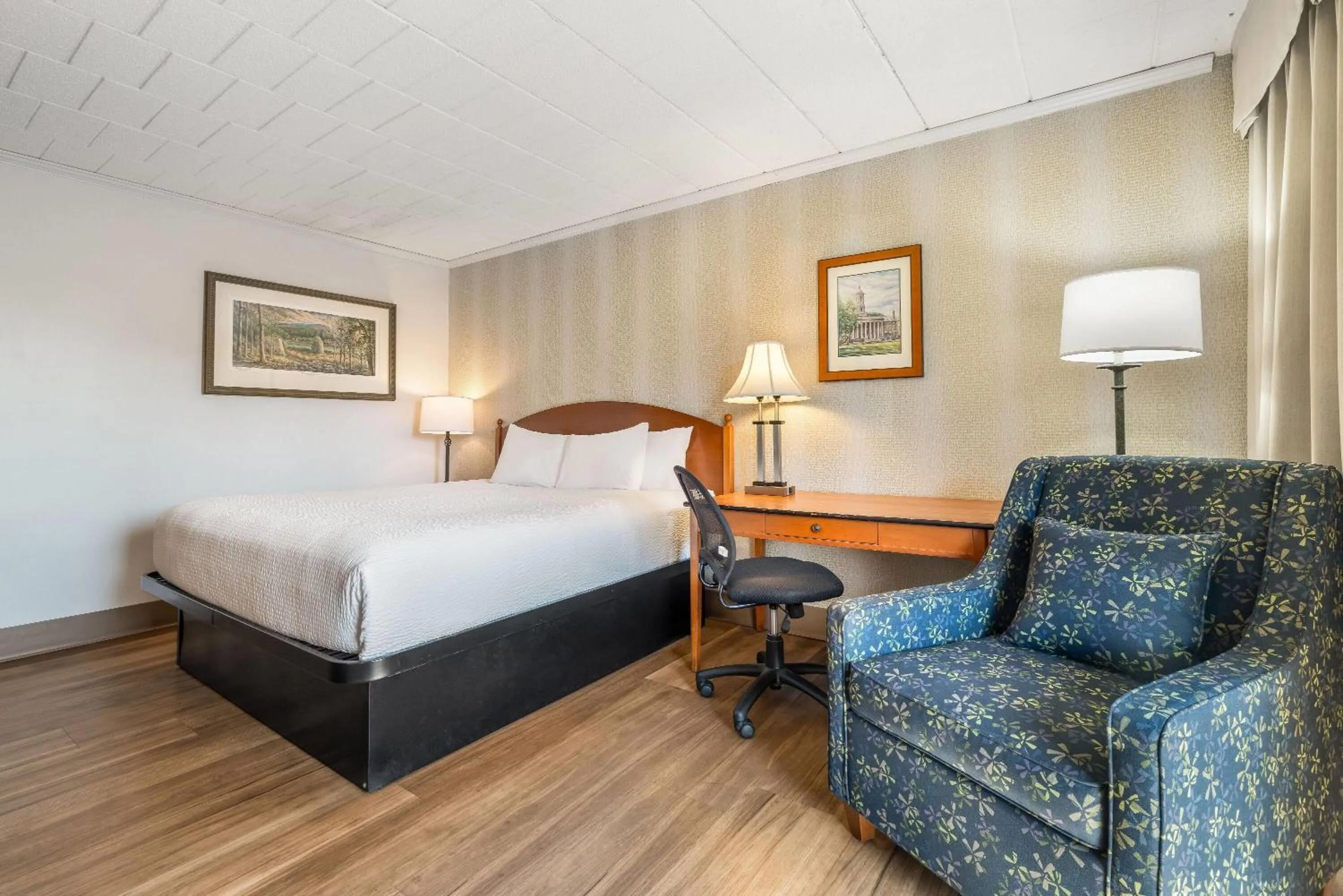 Bed in Ramada by Wyndham State College Hotel & Conference Center