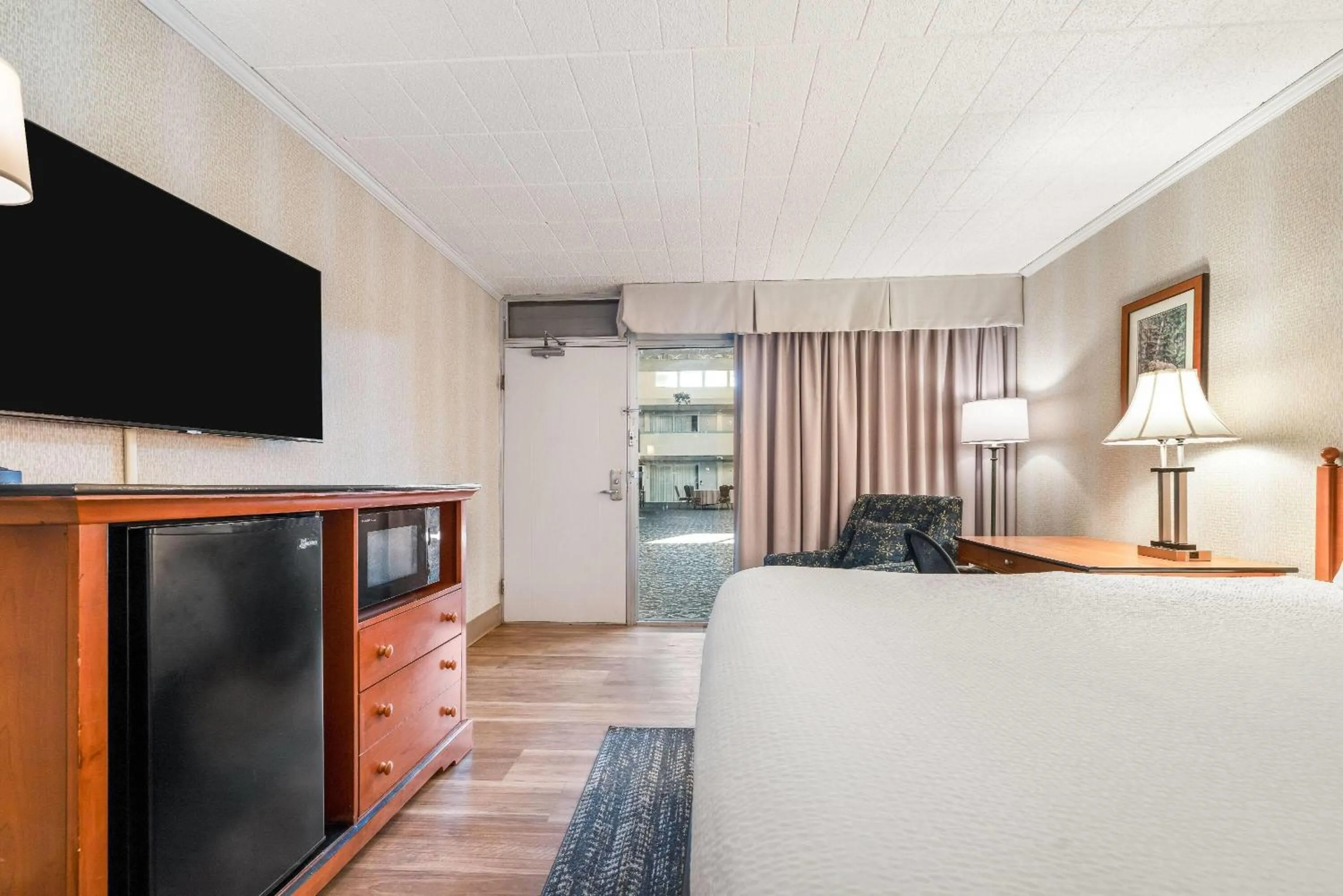 Bed in Ramada by Wyndham State College Hotel & Conference Center