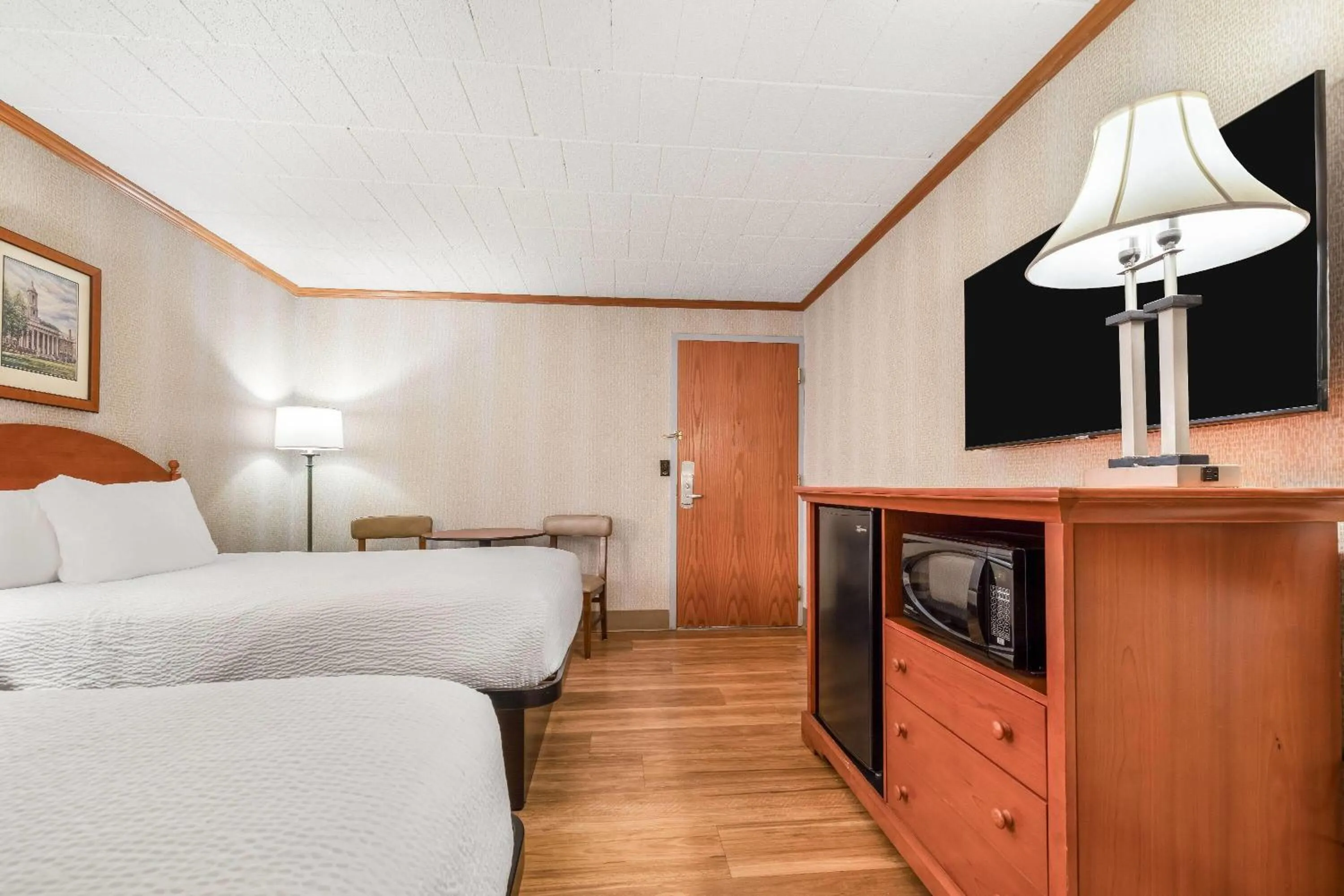 Bed in Ramada by Wyndham State College Hotel & Conference Center