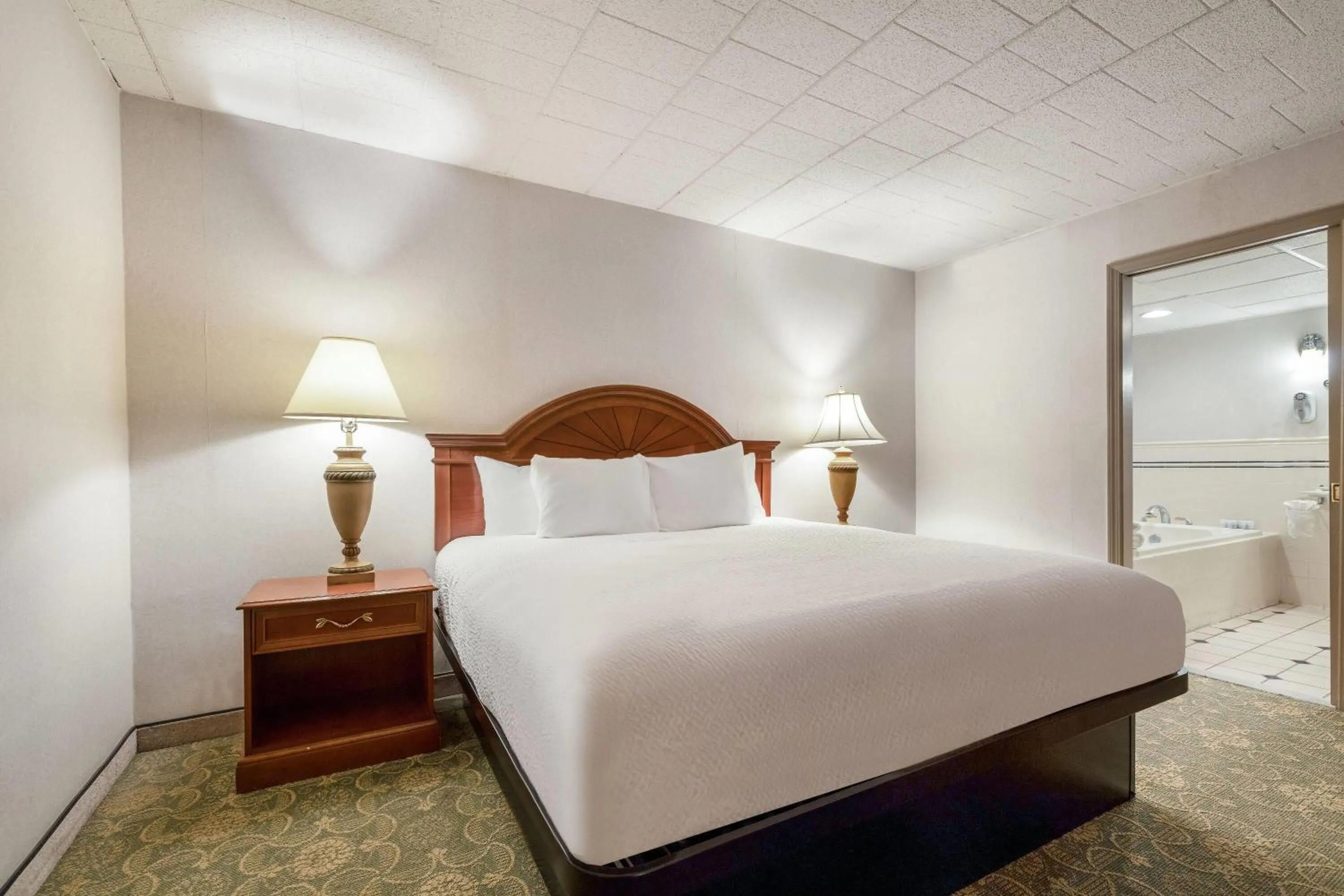 Photo of the whole room, Bed in Ramada by Wyndham State College Hotel & Conference Center