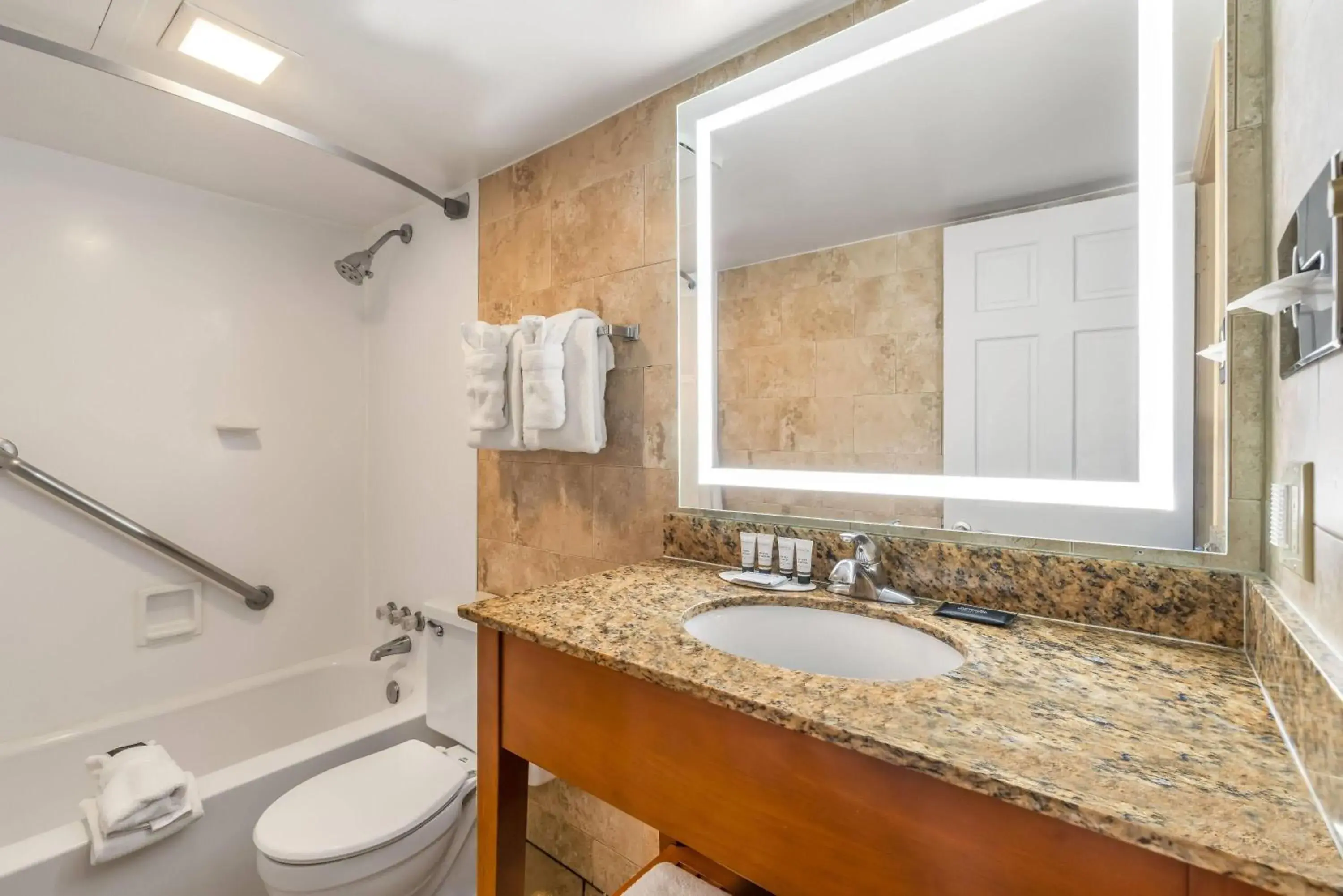 Bathroom in Ramada by Wyndham State College Hotel & Conference Center Bathroom in Ramada by Wyndham State College Hotel & Conference Center