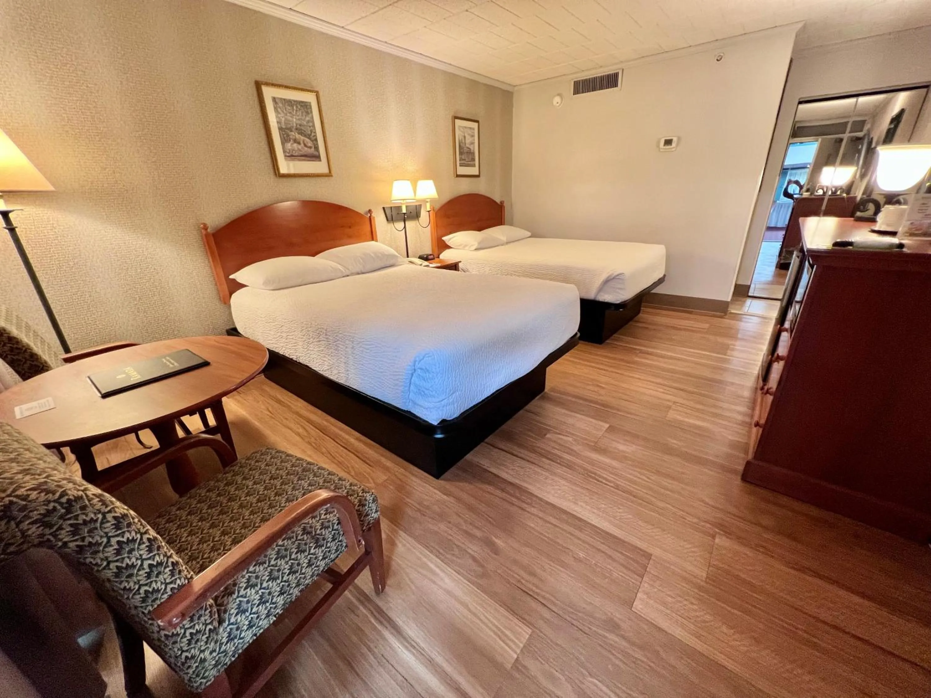 Bed in Ramada by Wyndham State College Hotel & Conference Center