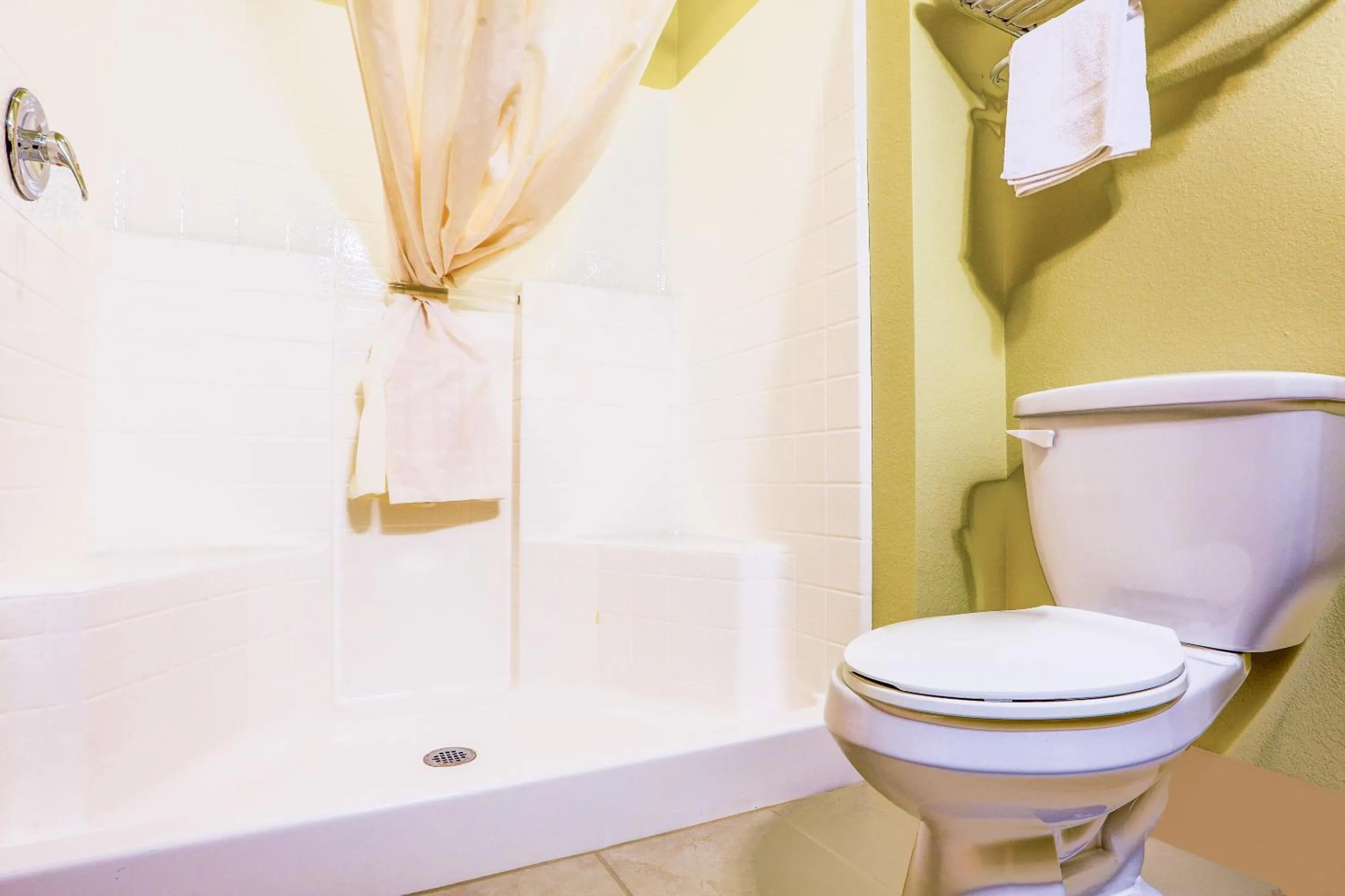 Bathroom in Evansville Inn & Suites by OYO