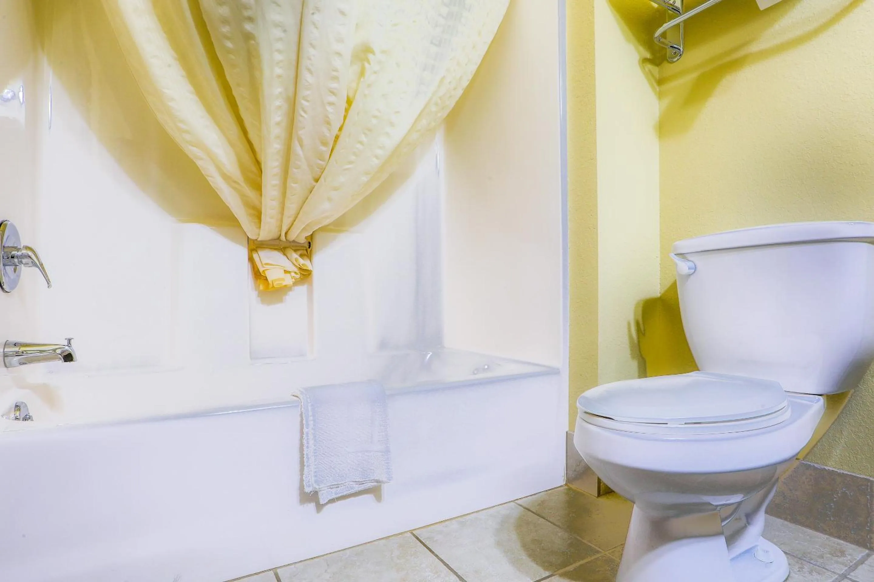 Bathroom in Evansville Inn & Suites by OYO