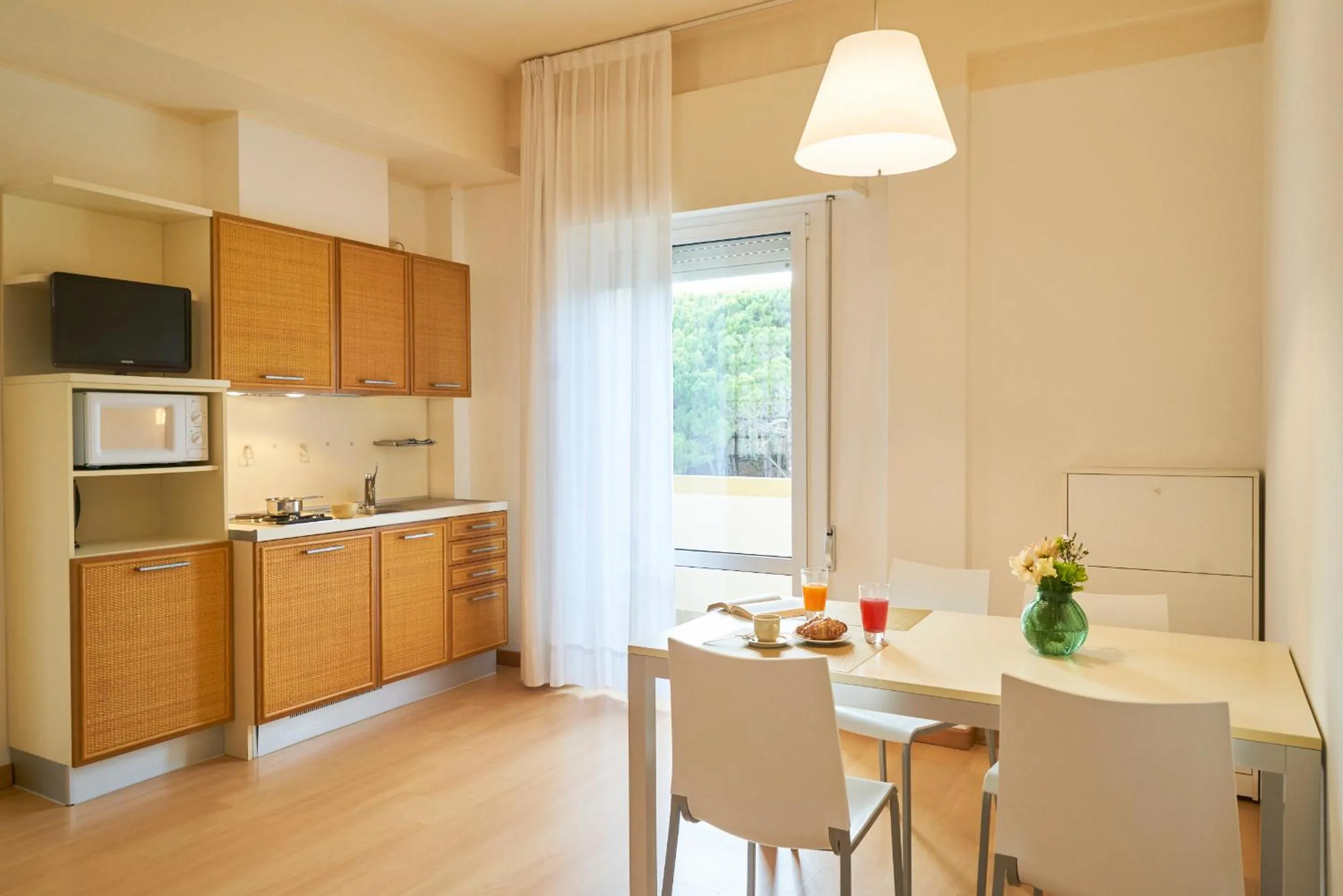Kitchen or kitchenette in Aparthotel La Pineta
