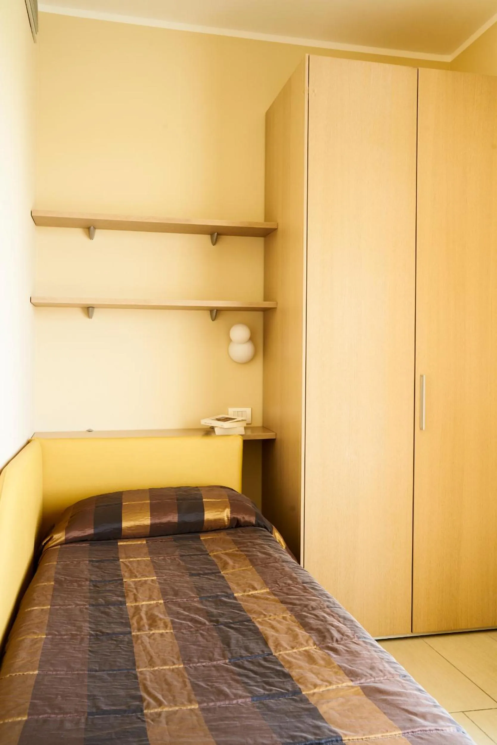 Bed in Aparthotel La Pineta