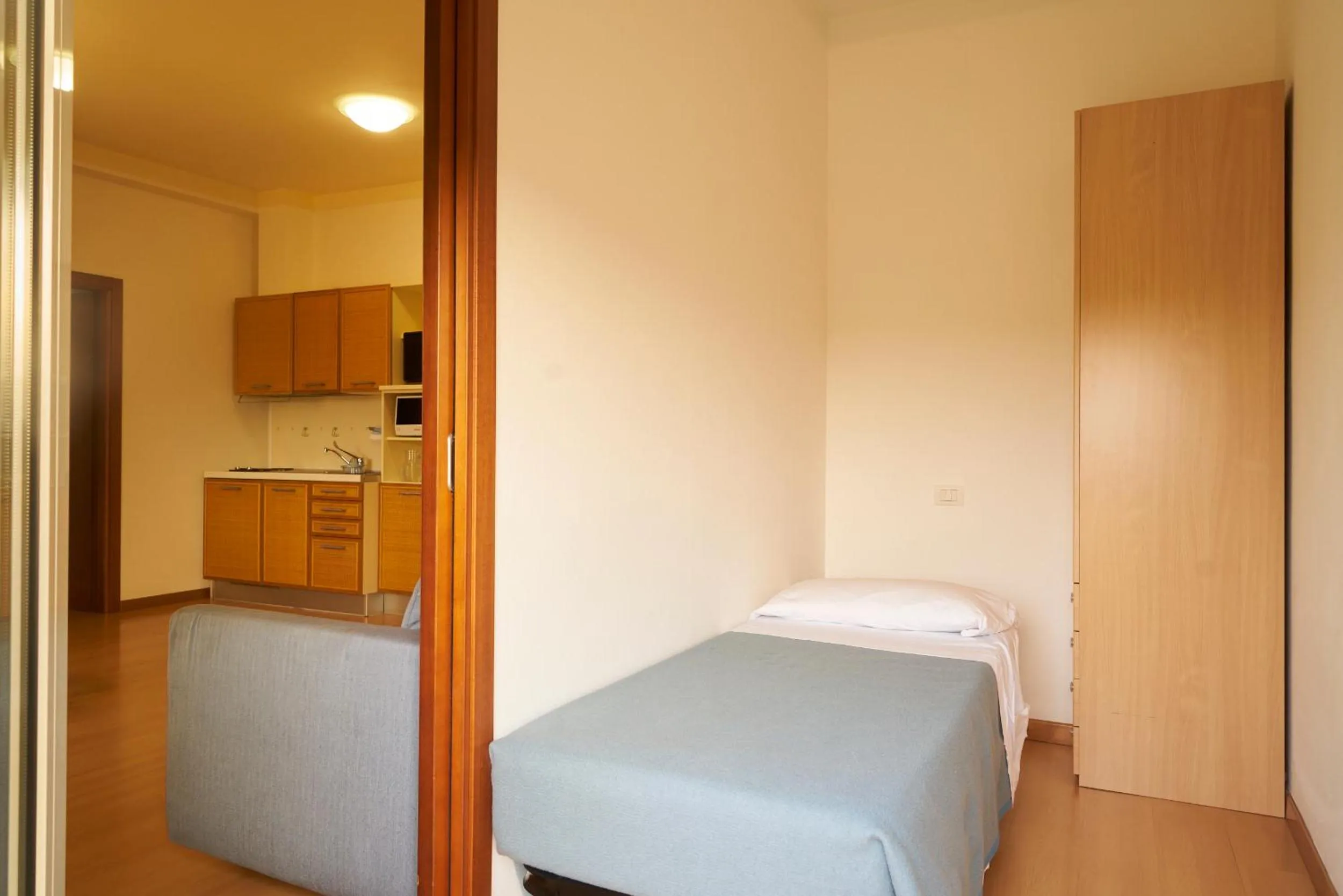 Bed in Aparthotel La Pineta