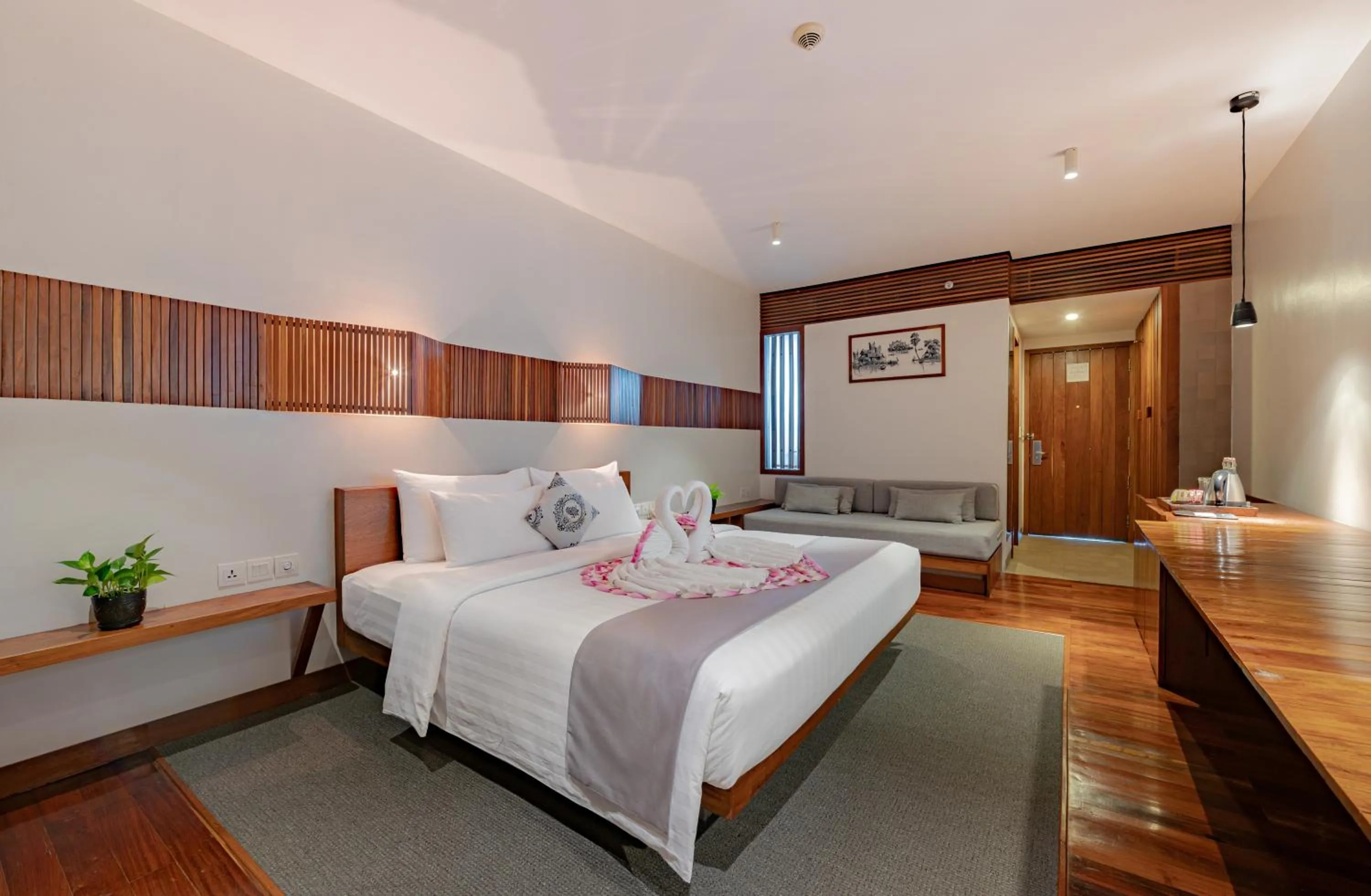 Bed in Hotel Somadevi Angkor Boutique and Resort